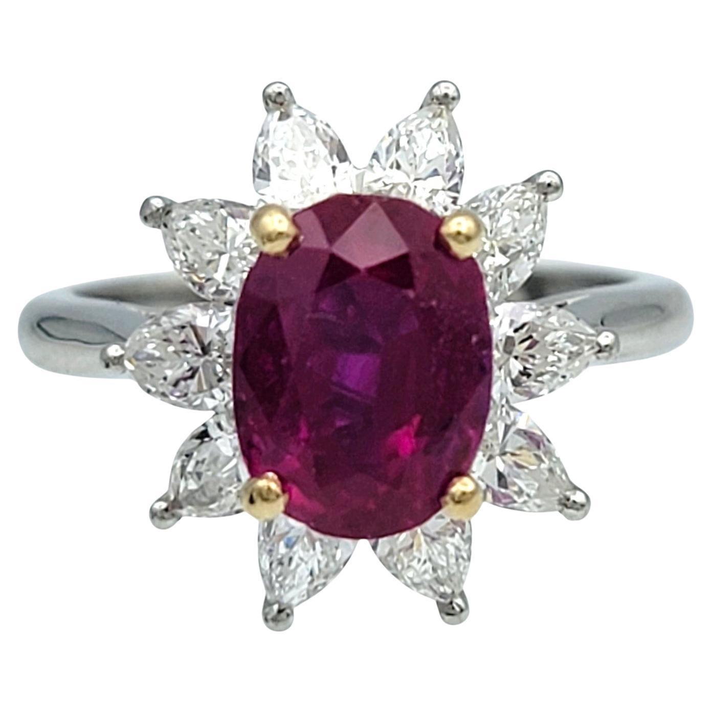 Vintage Tiffany & Co. Oval Cut Ruby and Pear Diamond Halo Ring in Platinum