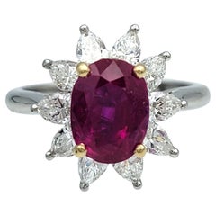 Vintage Tiffany & Co. Oval Cut Ruby and Pear Diamond Halo Ring in Platinum
