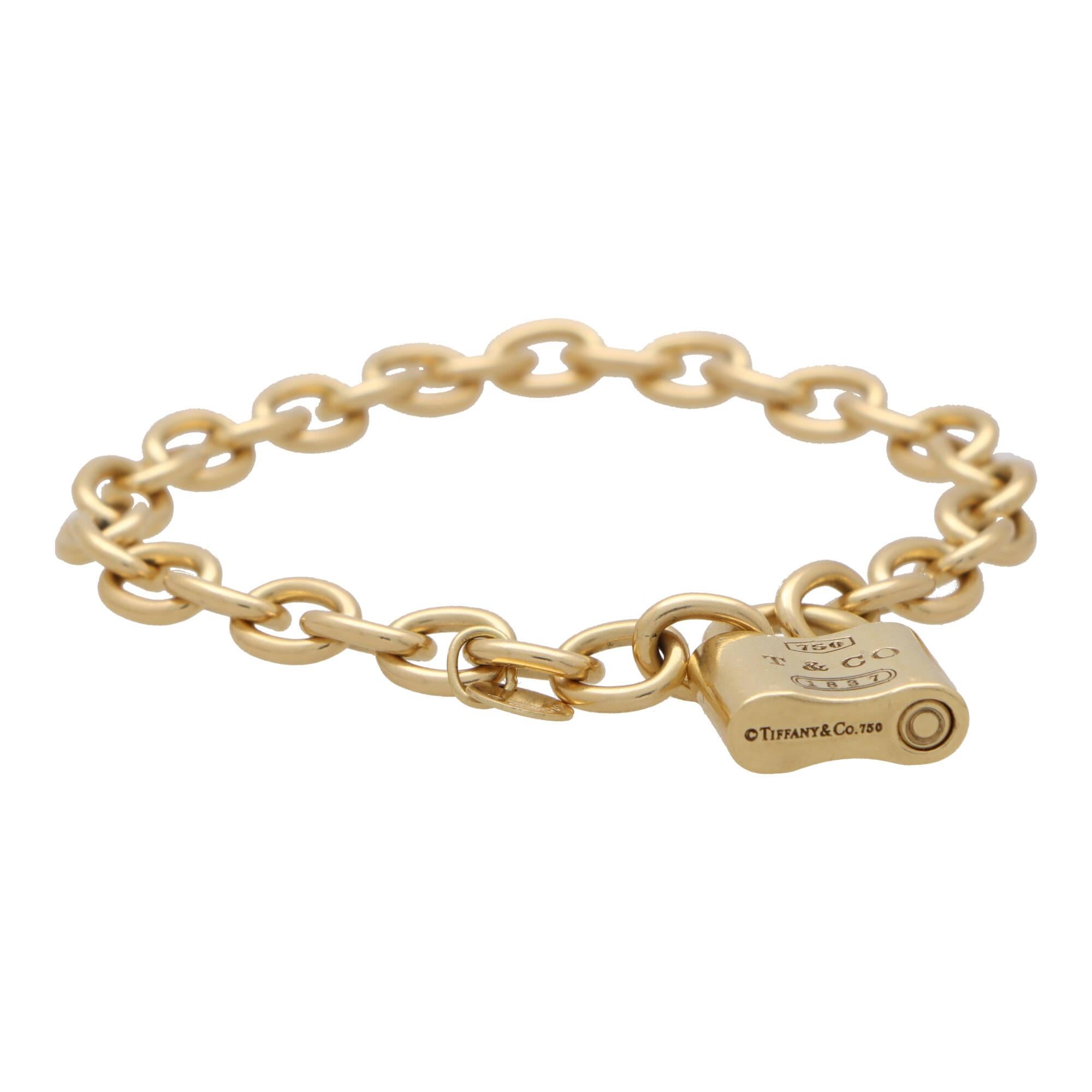 A vintage Tiffany & Co. open link ‘ Padlock’ bracelet set in 18k yellow gold.

The bracelet is composed of 32 oval solid yellow gold links; all of which are connected together by a Tiffany & Co. padlock clasp. Due to the subtlety of the design, this