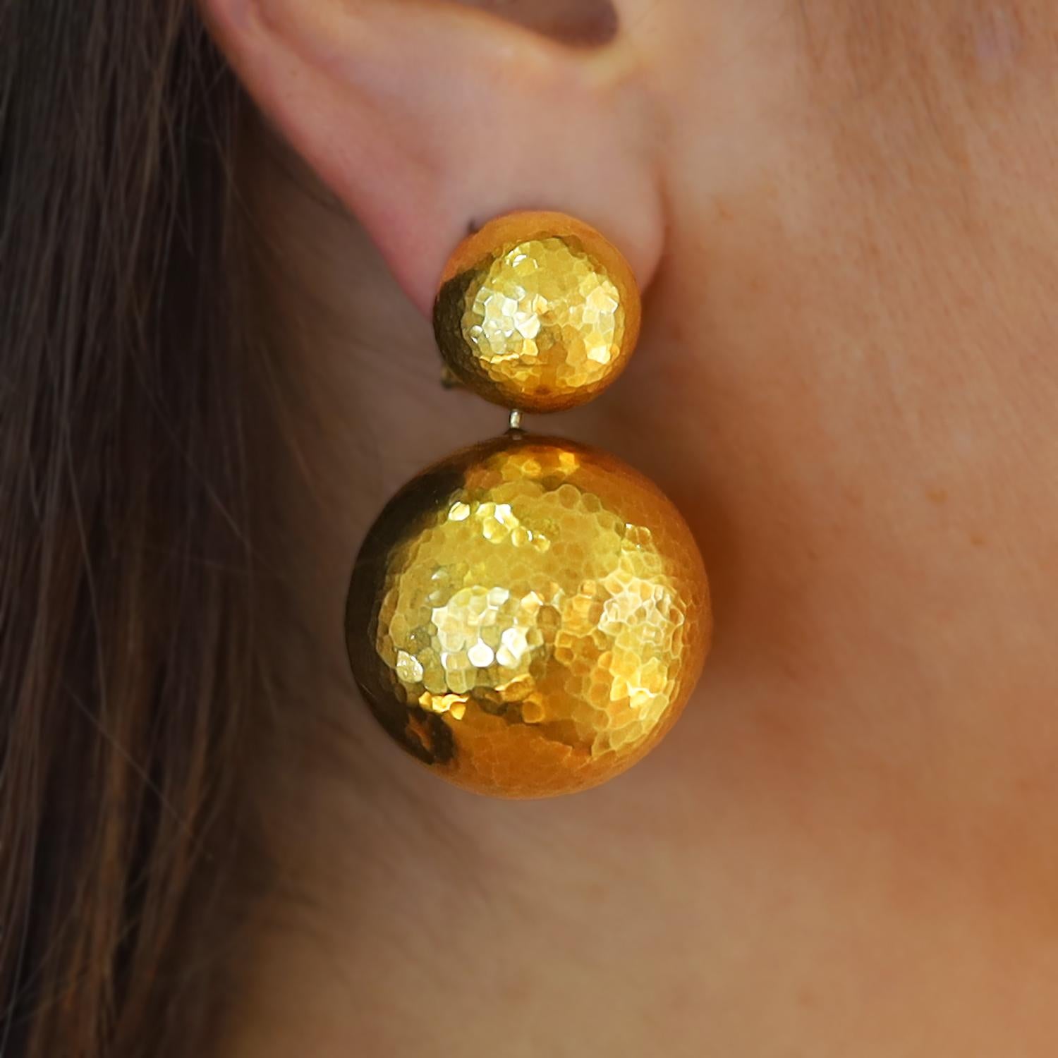 The vibe of these vintage Tiffany & Co. earrings is pure 80's disco ball. Designed by Paloma Picasso and launched as the Hammered Planets collection. You will love the rich patina of the high karat 18k gold and the subtle shimmer of their texture.