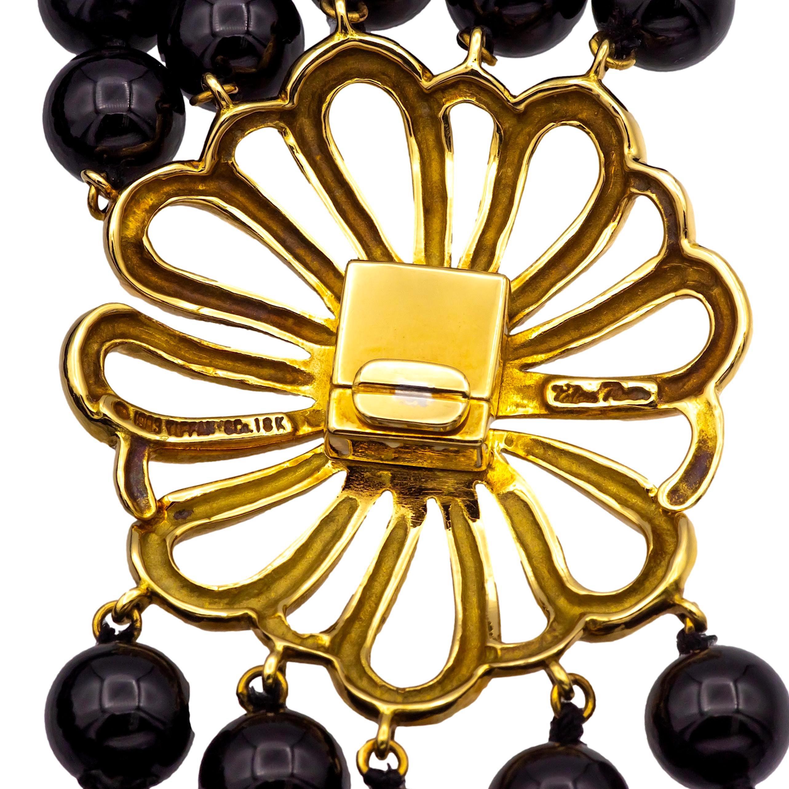 This vintage Tiffany & Co. Paloma Picasso choker necklace, designed in the 1980s, exudes an earthy elegance, and a grounded sophistication. Featuring five strands of polished onyx beads, each measuring 7.8mm in diameter, the strands are connected by