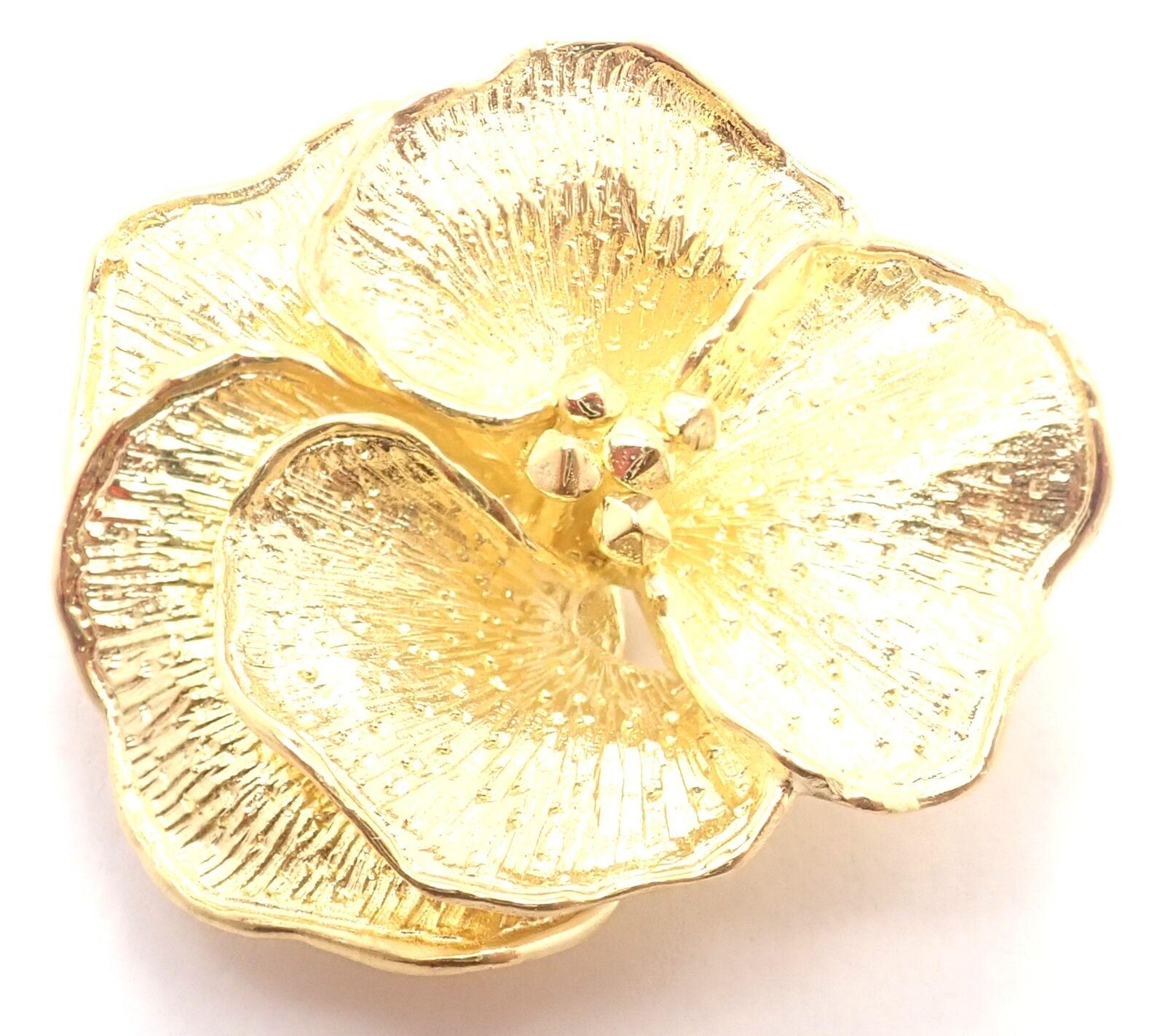 18k Yellow Gold Pansy Flower Brooch Pin by Tiffany & Co.
Details: 
Weight: 15.9 grams
Measurements: 34mm x 31mm
Stamped Hallmarks: Tiffany &Co 18k Italy
YOUR PRICE: $4,000
T3201mned
