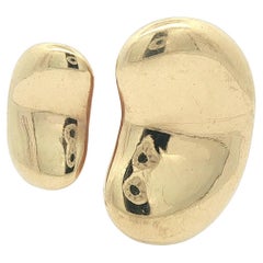 Vintage Tiffany
Co. Anillo Peretti de oro amarillo macizo de 18 quilates con dos judías Vintage Tiffany
Co. Anillo Peretti de oro amarillo macizo de 18 quilates con dos judías