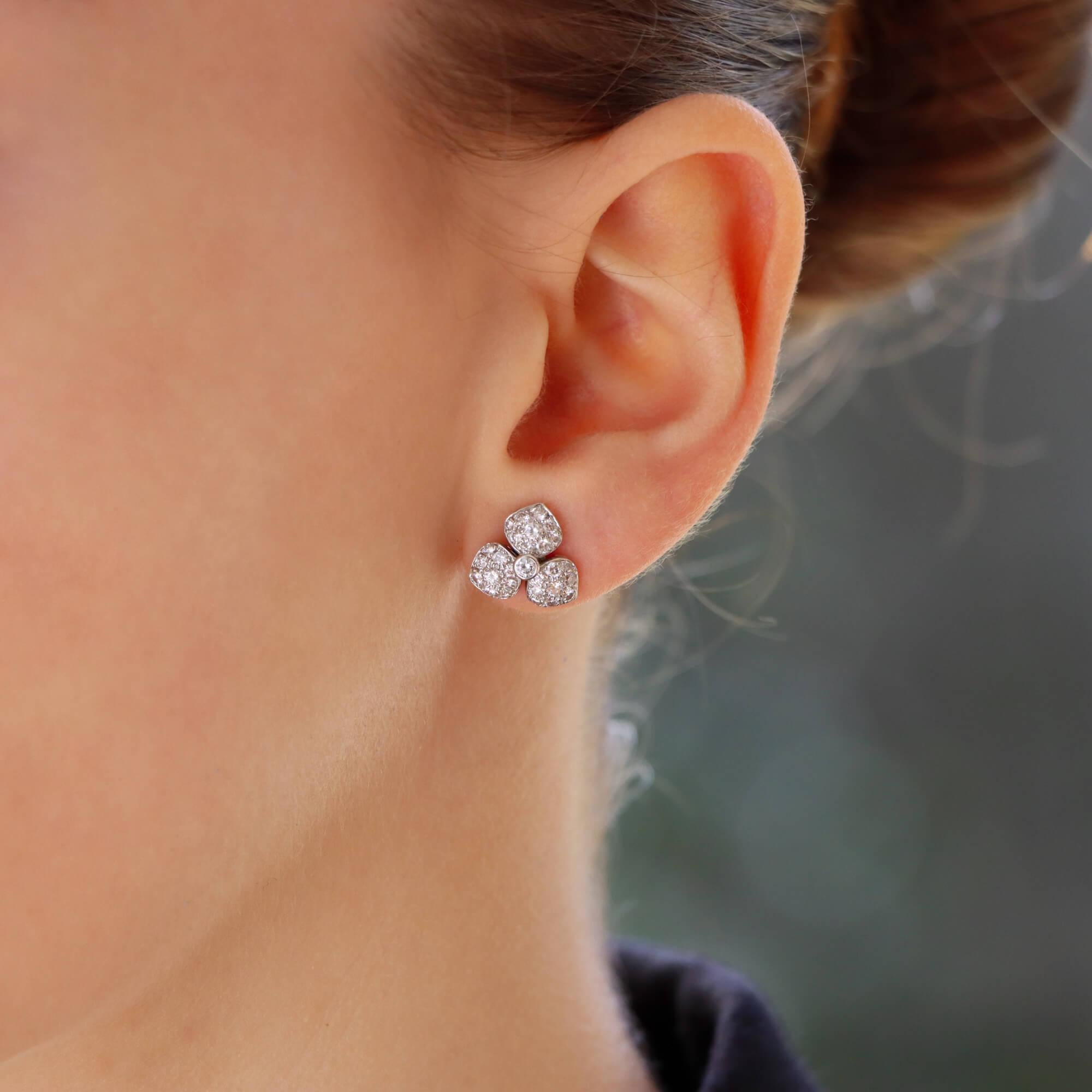  A beautiful vintage pair of Tiffany & Co. diamond 'petals' earrings set in platinum.

Each earring is composed of an elegant flower motif pave set throughout with round brilliant cut diamonds. The diamonds are intricately set within the petals of