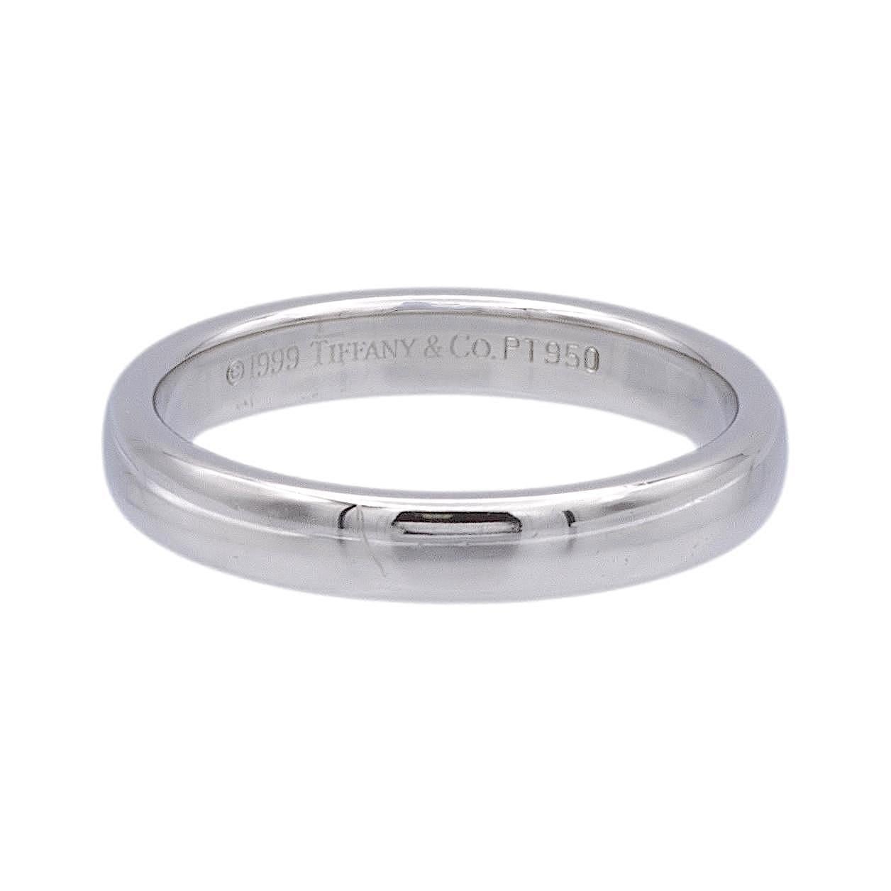 Vintage Tiffany & Co. 3mm Classic wedding band ring finely crafted in platinum. Made in 1999. Fully hallmarked with logo and metal content.
 
Ring Specifications
Brand: Tiffany & Co.
Style: Classic (comfort-fit)
Hallmarks: © 1999 Tiffany & Co.