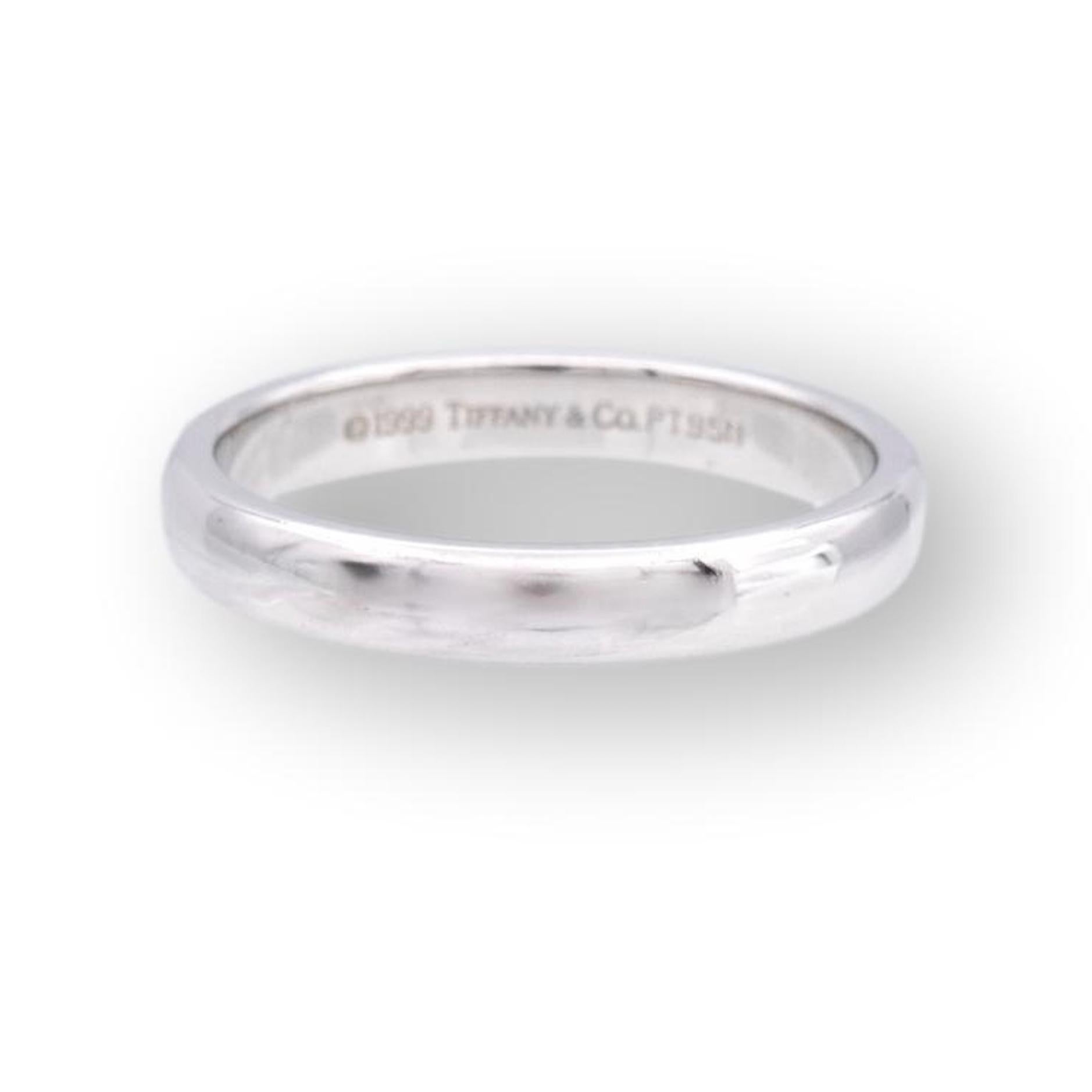 Vintage Tiffany & Co. 3mm Classic wedding band ring finely crafted in platinum. Made in 1999. Fully hallmarked with logo and metal content.

Ring Specifications
Brand: Tiffany & Co.
Style: Classic (comfort-fit)
Hallmarks: © 1999 Tiffany & Co.