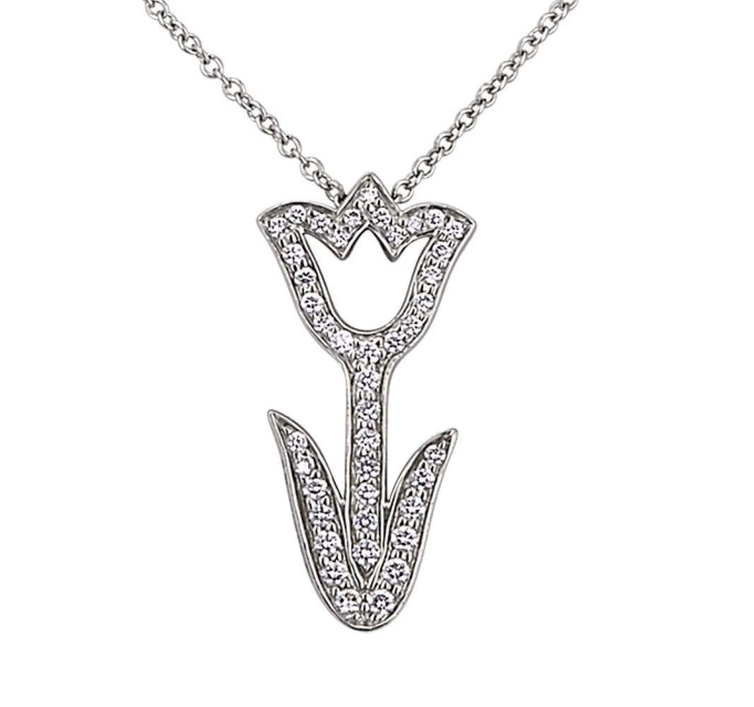 Vintage Diamond Tulip Pendant by Tiffany & Co, The Pendant has 42 Round Brilliant Cut Diamonds that weigh .42 carats total, Platinum.

The most common meaning for tulips is perfect or deep love. Gift this to someone special or give as a treat to