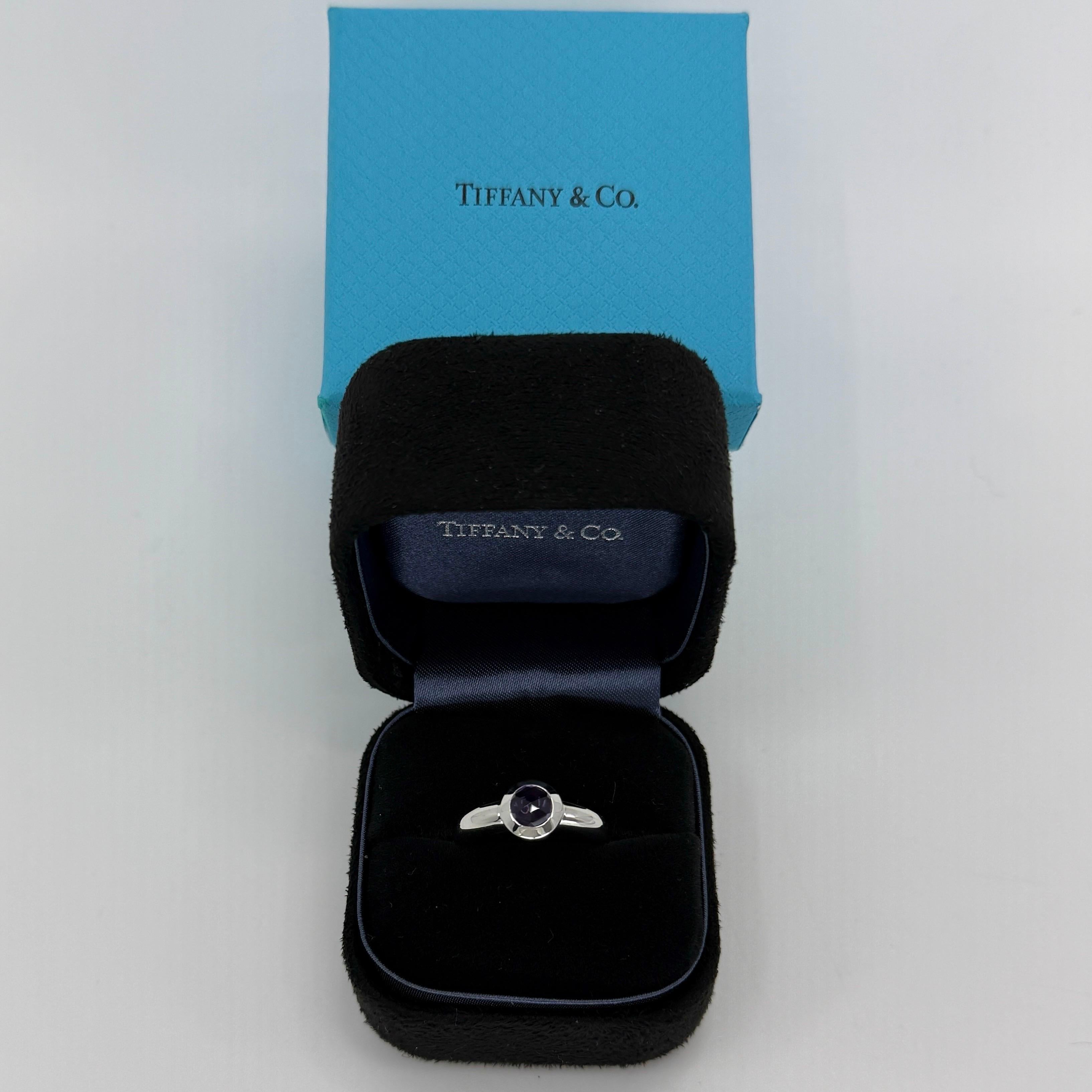 Rare Tiffany & Co. Vivid Purple Amethyst Rose Cut 18k White Gold Bezel Solitaire Ring.

A beautifully made white gold ring set with a stunning vivid purple natural amethyst. Superb colour, clarity and unique rose cut. Fine jewellery houses like
