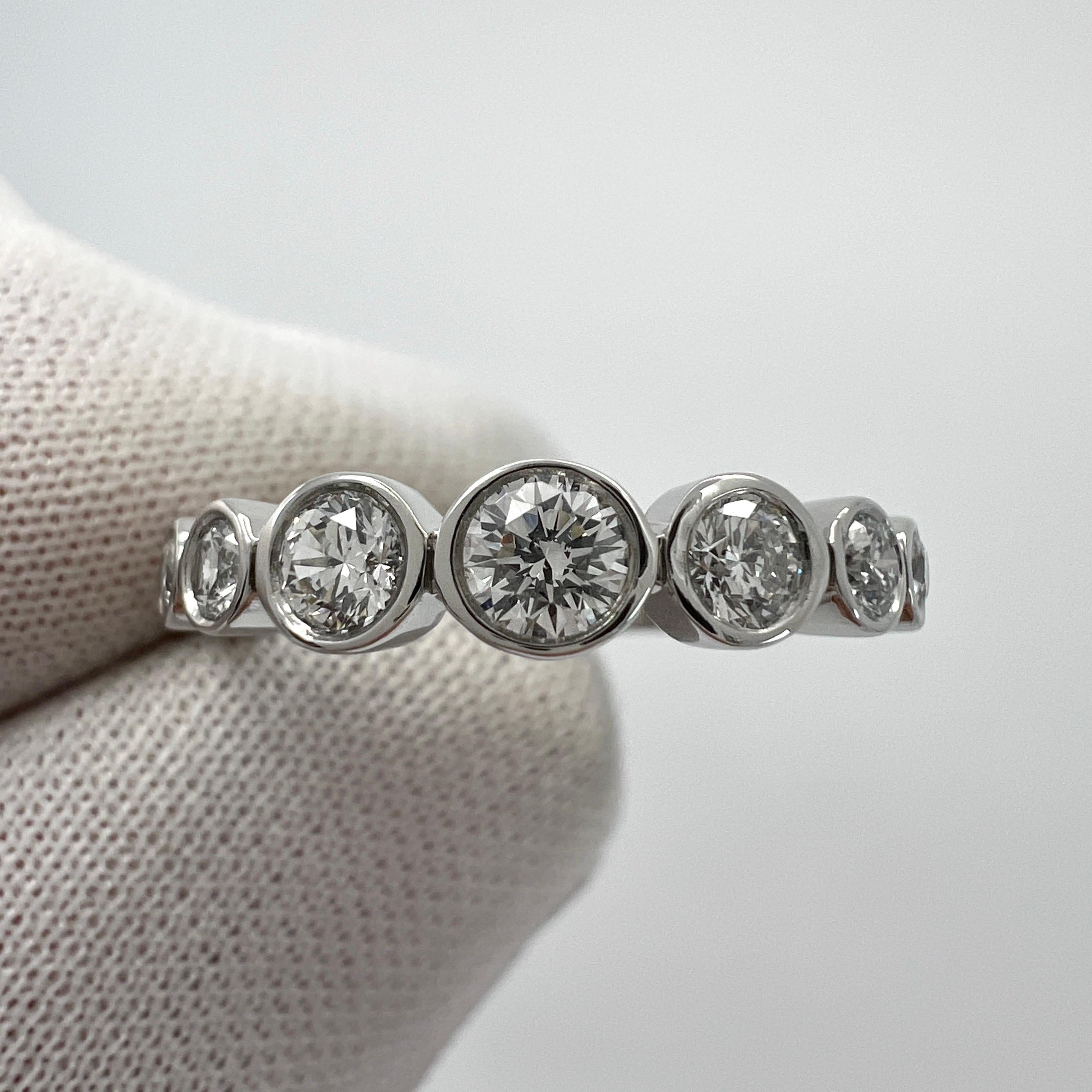 Vintage Tiffany & Co. Round Cut Graduating Natural Diamond 'Jazz' 950 Platinum Half Eternity Ring.

A beautifully made platinum ring from the Tiffany 'Jazz' collection, set with excellent quality round brilliant cut natural white diamonds. Superb