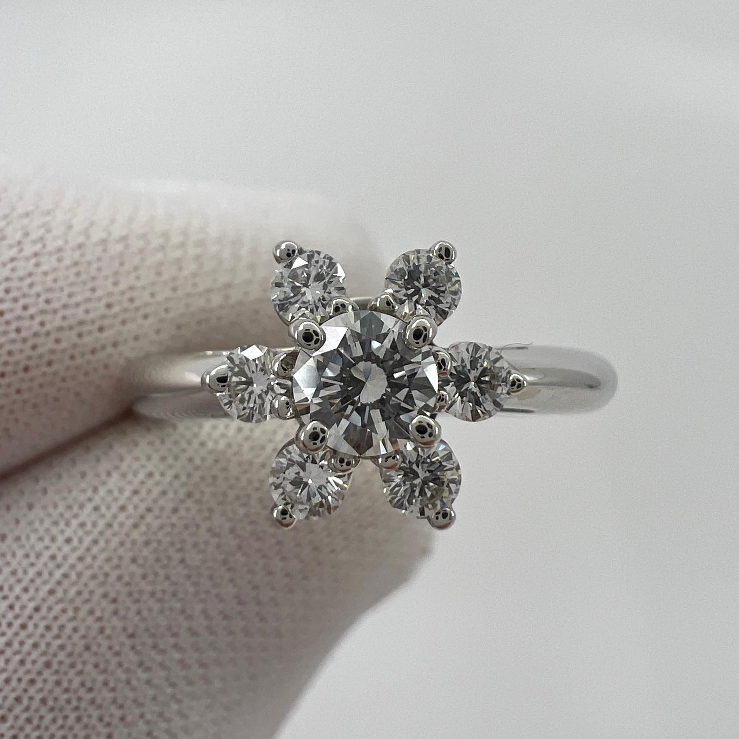 Vintage Tiffany & Co. Natural Diamond 950 Platinum Flower 'Buttercup' Ring.

A beautifully made platinum cluster ring set with a stunning 3.8mm round cut natural diamond centre stone. Superb colour, clarity and cut. VVS1 clarity E/F