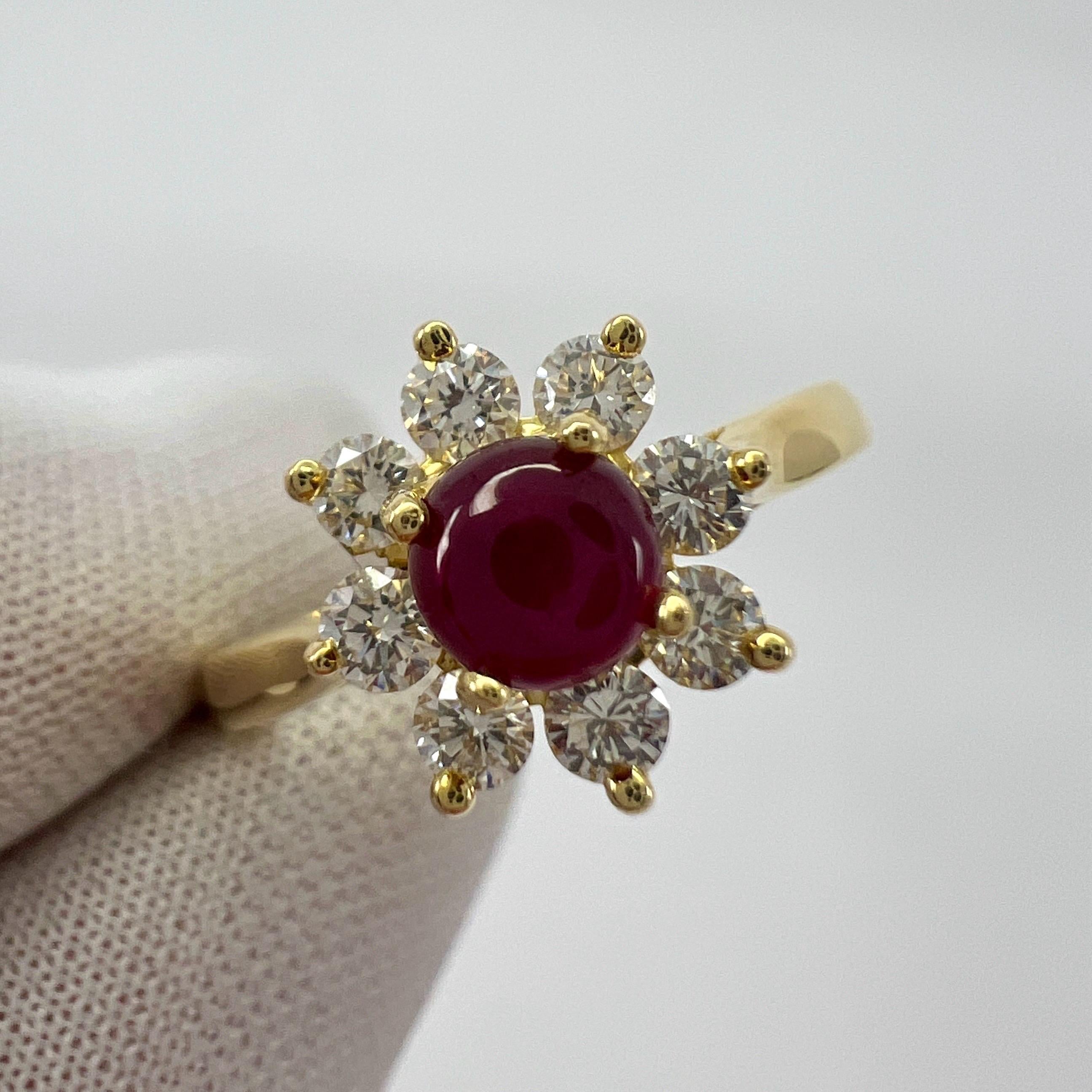 Vintage Tiffany & Co. Natural Round Cabochon Ruby And Diamond 18k Yellow Gold Flower 'Buttercup' Ring.

A beautifully made yellow gold cluster ring set with a stunning 4.4 mm round cabochon cut natural ruby centre stone. Superb colour with very good