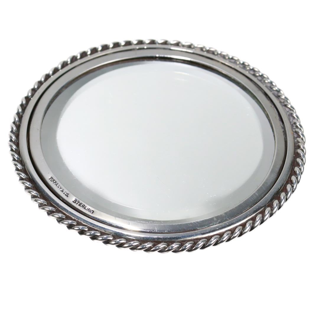 A fine silver hand mirror.

By Tiffany & Co.

In sterling silver.

Marked to the front for Tiffany & Co. / Sterling.

Simply a wonderful mirror!

Date:
20th Century

Overall Condition:
It is in overall good, as-pictured, used estate condition.