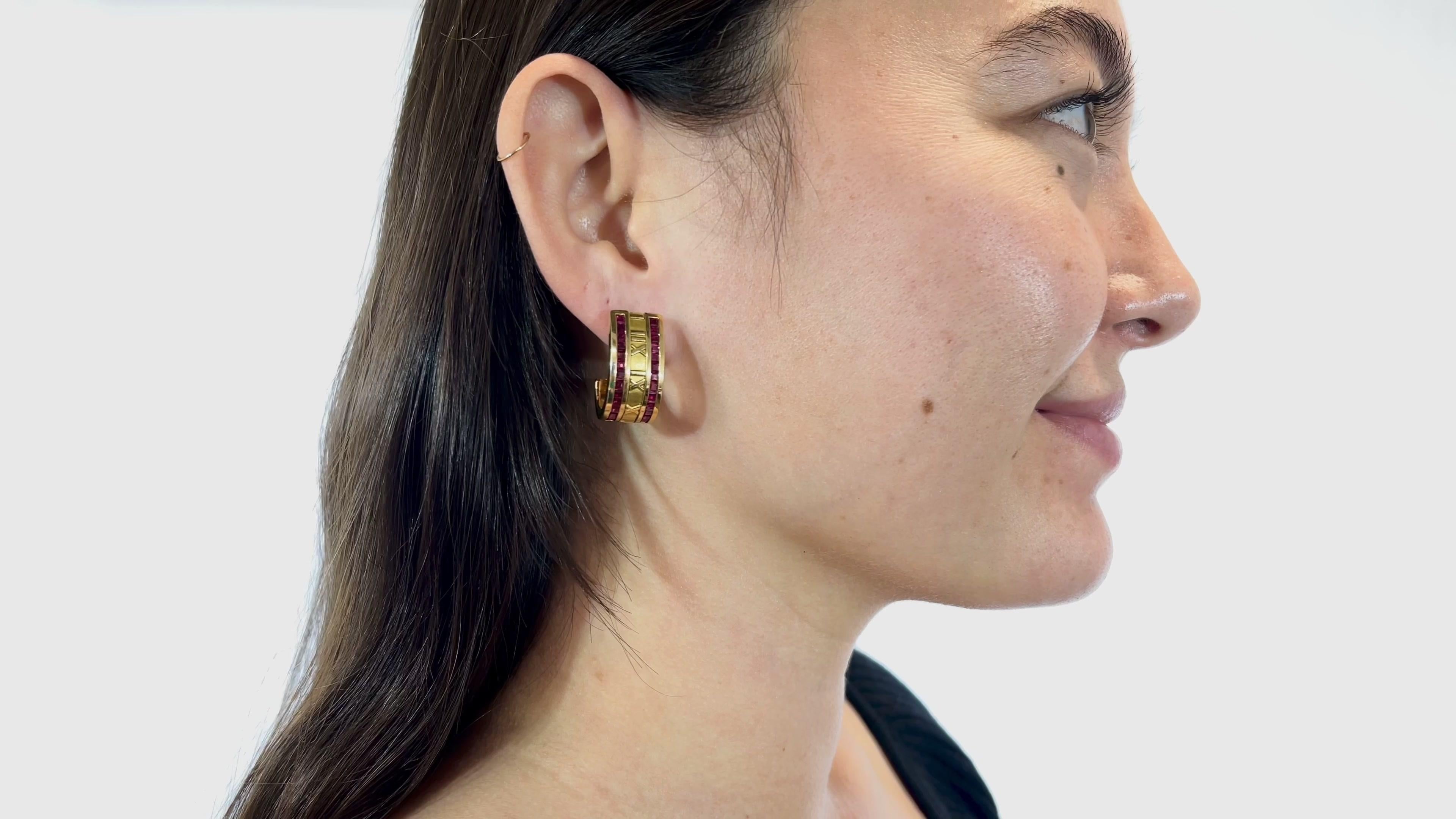 One Pair of Vintage Tiffany & Co. Ruby 18 Karat Gold Atlas Hoop Earrings. Featuring 52 square cut rubies with a total weight of approximately 7.80 carats. Crafted in 18 karat yellow gold, signed Tiffany & Co., Italy, 1995, with purity marks. The