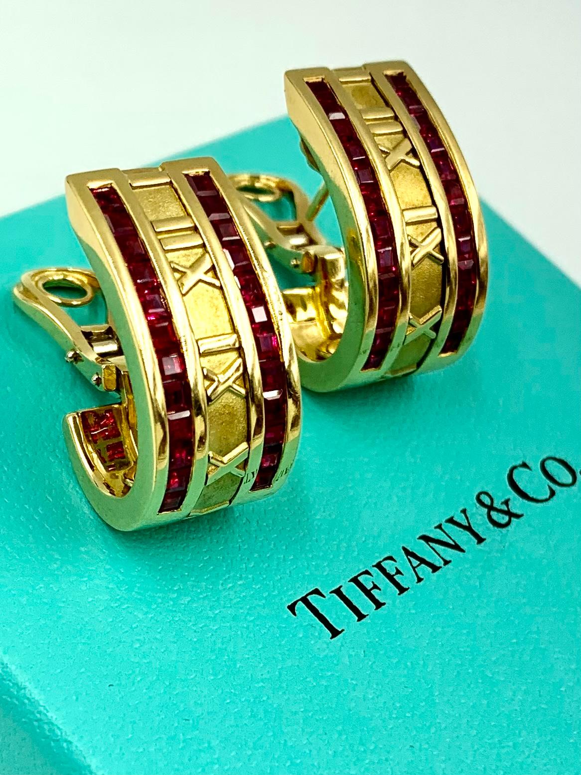 Time and Timing, the iconic Tiffany & Co. Atlas collection explores the significance and value of this precious commodity. Each of these stunning earrings features 24 square cut rubies, coinciding with 24 hours of each day. Scarce model with