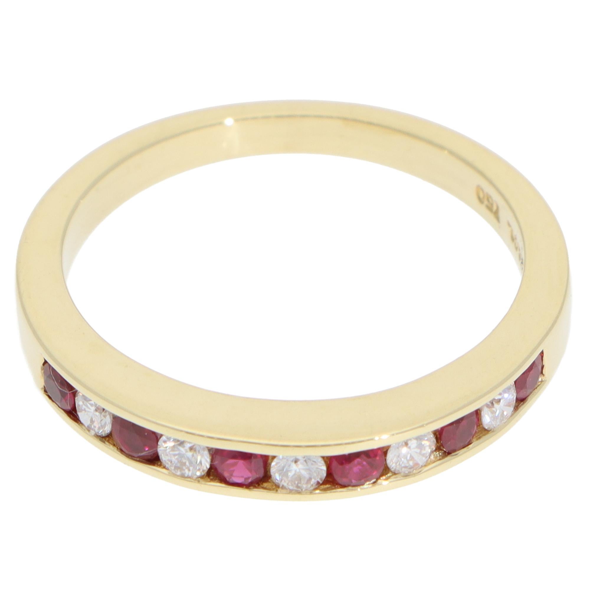 A beautiful vintage Tiffany & Co. ruby and diamond half-eternity ring set in 18k yellow gold.

The ring is composed of 6 red rubies and 5 round brilliant-cut diamonds, channel set securely within a 3-millimetre yellow gold band. This half-eternity