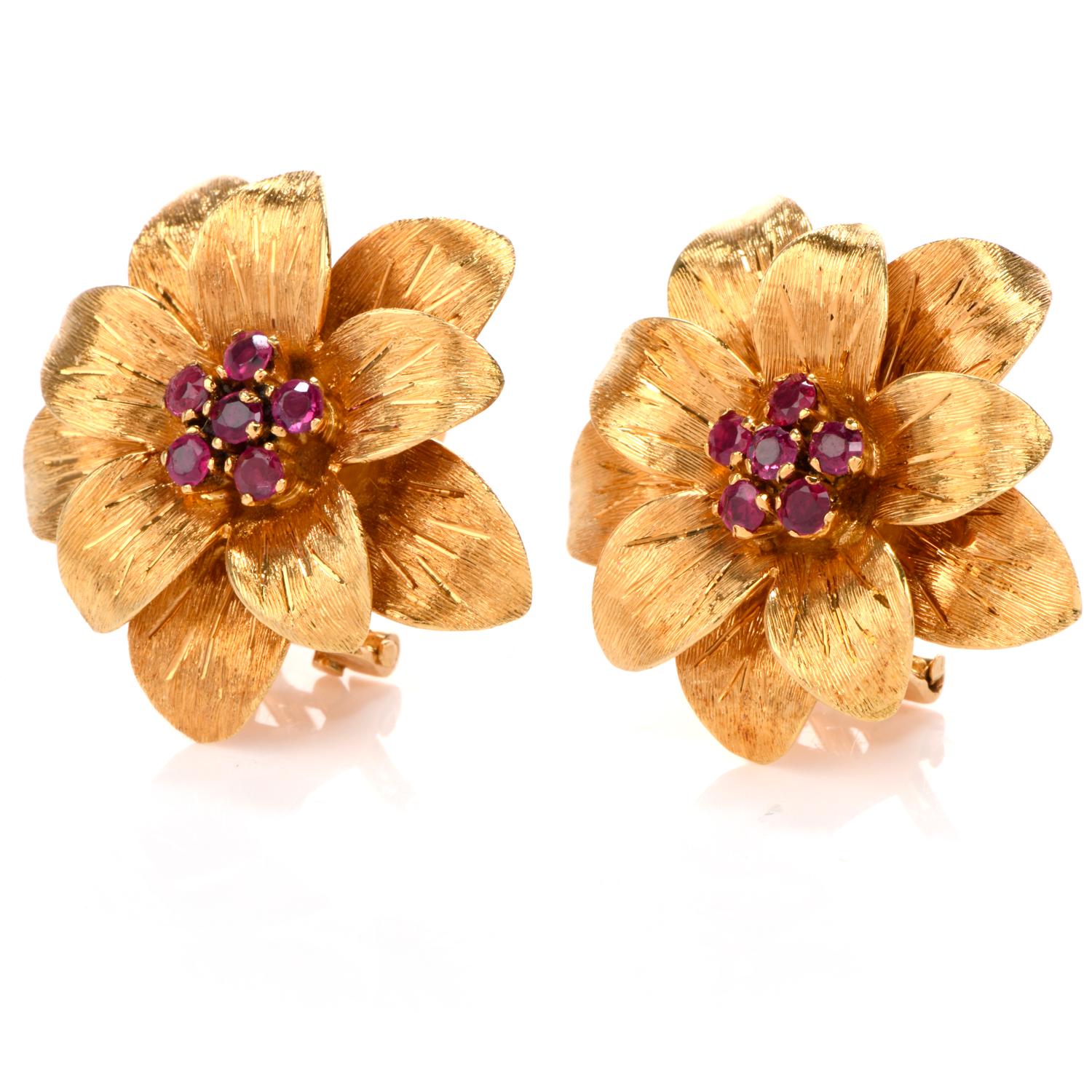 These classically beautiful designer Tiffany & Co. earrings were crafted circa 1950 in 18-karat yellow gold, weighing 12.0 grams and measuring 23mm. Simulating flowers with curved petals. Showcasing a clustered center of 12 prong-set, round-cut red