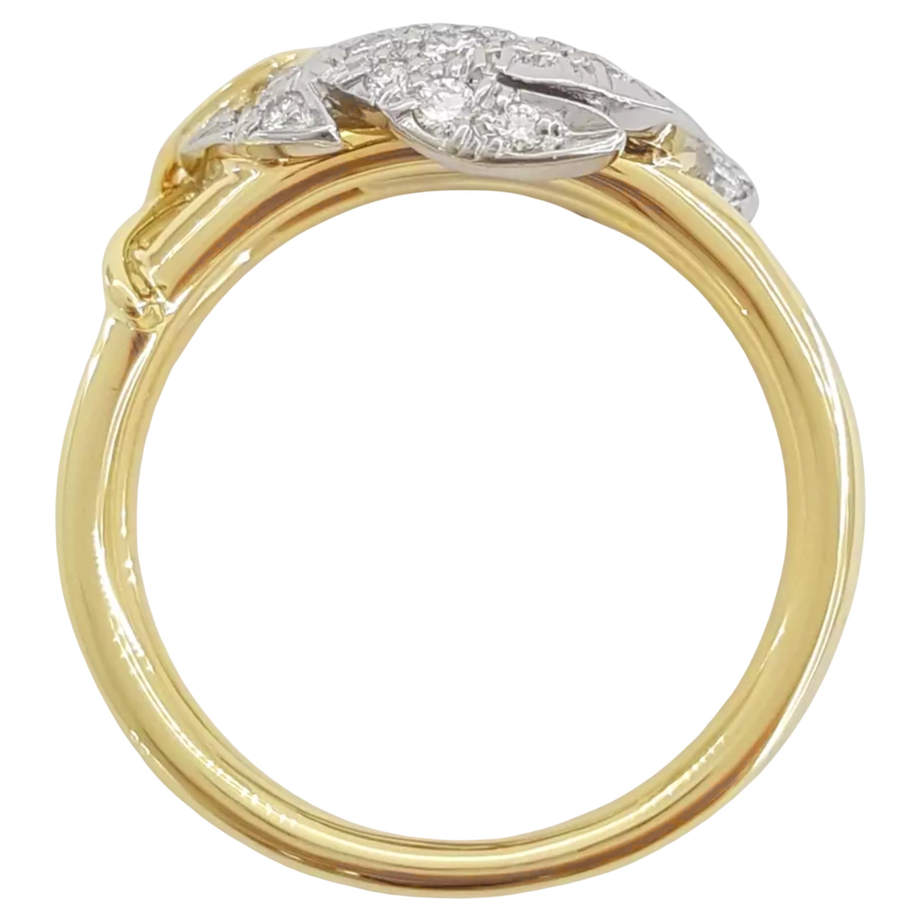 Vintage Tiffany & Co. Schlumberger® Round Brilliant Cut Diamond Two Leaf Band Ring

Discover the elegance of this exquisite vintage ring featuring a total weight of approximately 0.65 carats in 26 natural round brilliant cut diamonds. The diamonds