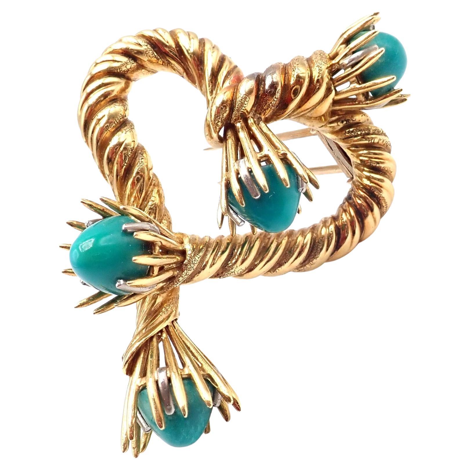 18k Yellow Gold Turquoise Heart Shape Brooch Pin by Jean Schlumberger for Tiffany & Co.
With 4 Large Turquoise beads
This brooch comes with original Tiffany & Co box.
Details:
Measurements: 53mm x 38mm
Weight: 25.4 grams
Stamped Hallmarks: Tiffany