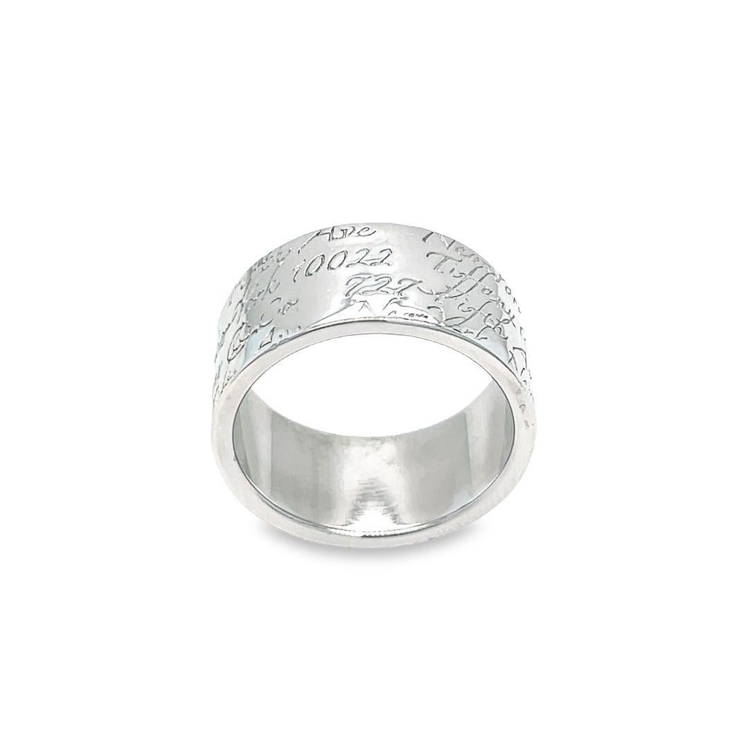 Wide band is from the NOTES Collection. It is crafted from the sterling silver with Tiffany & Co. and address in script around the entire 10mm wide band. It's currently size 8. Please note, this is a fairly wide band, therefore it run a little