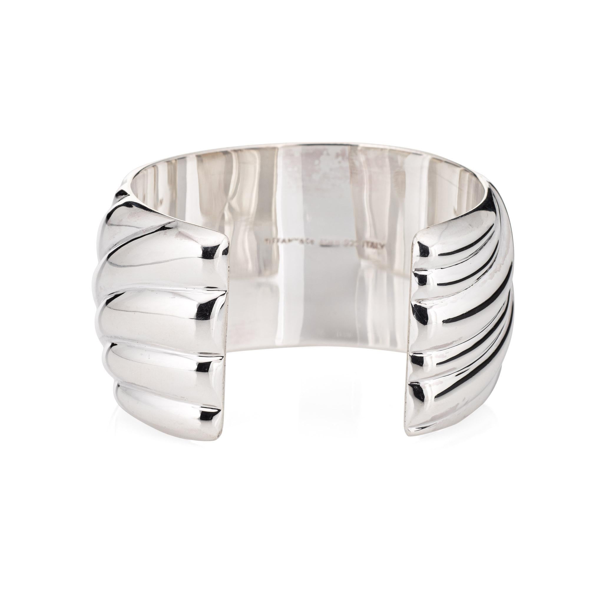 Stylish and finely detailed vintage Tiffany & Co cuff bracelet, crafted in sterling silver.  

The sculpted cuff bracelet is wide (34mm - 1.33 inches) and makes a great statement on the wrist. The bracelet is designed to fit a small wrist (6 inches)