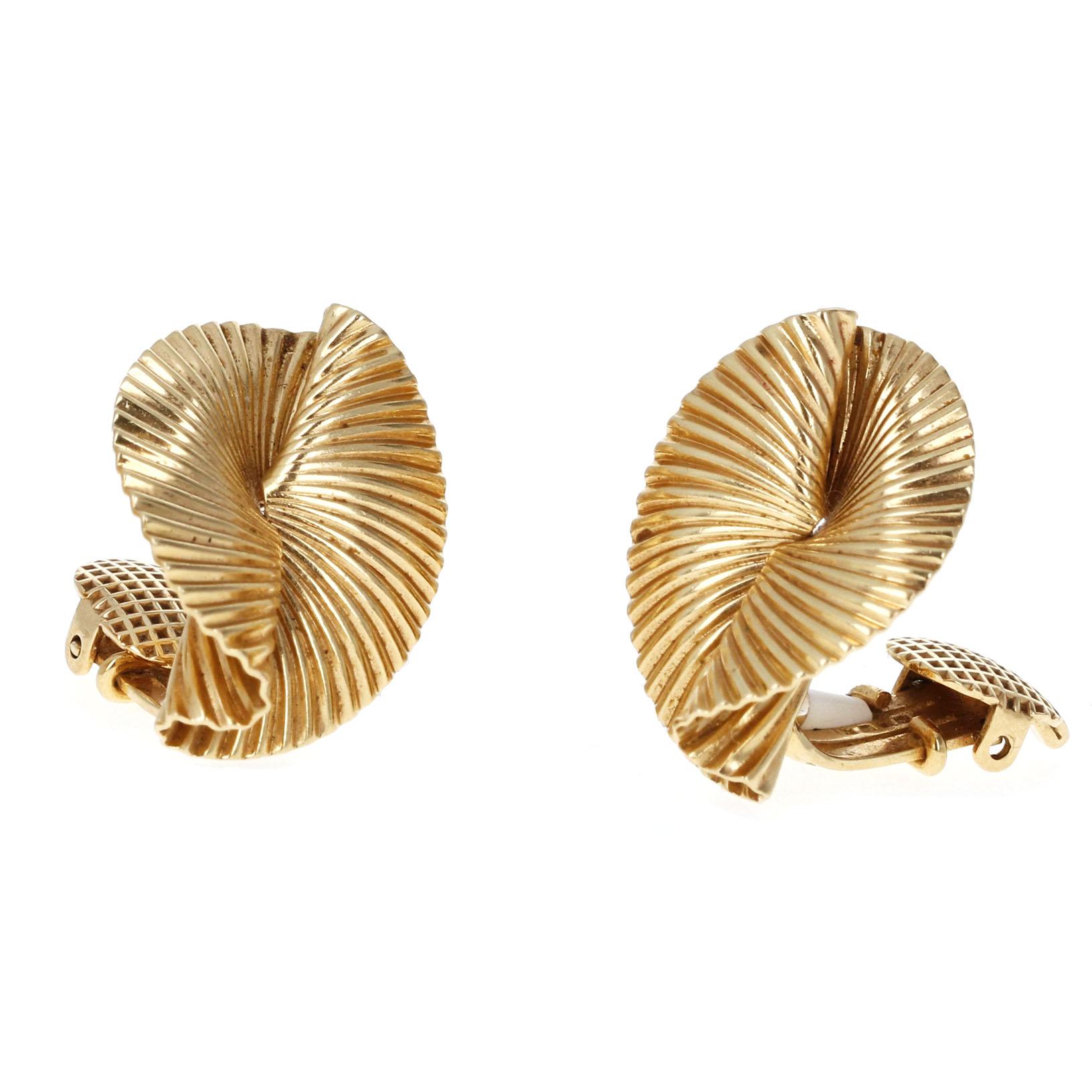 Discover the timeless elegance of this Tiffany & Co. matching brooch and clip-on earring set, crafted in 14K yellow gold and designed by the renowned George Schuler. This Mid-Century set embodies iconic retro sophistication with a sculpted,