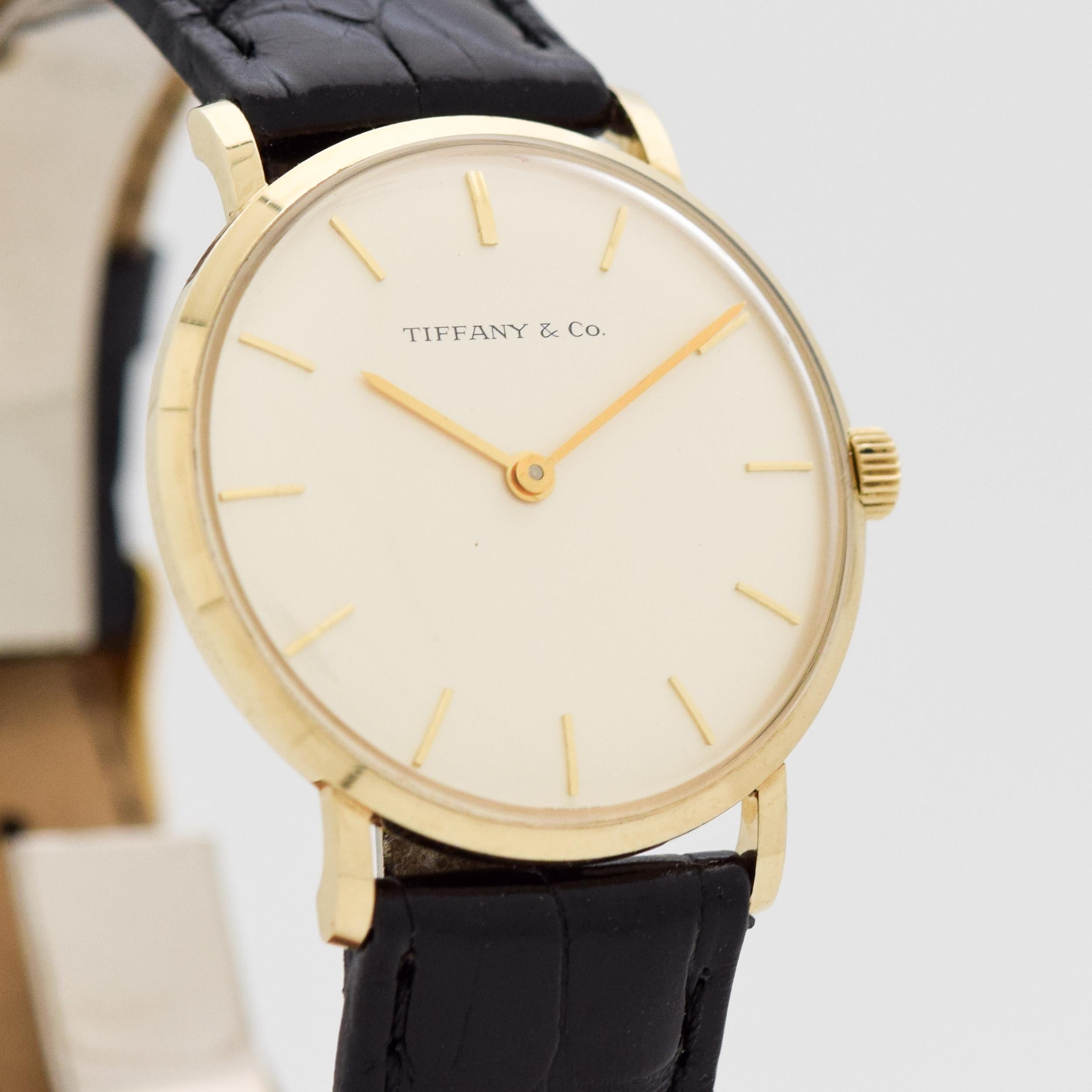 1969 Tiffany & Co. Ref. T 101-C 14K Yellow Gold Watch Rare Tiffany & Co, Recognition/Appreciation of Service with CBS (presented to R. Dunn, who was a cameraman with CBS for 43 years) watch Original Silver Dial with Applied Gold Stick Markers. 32mm