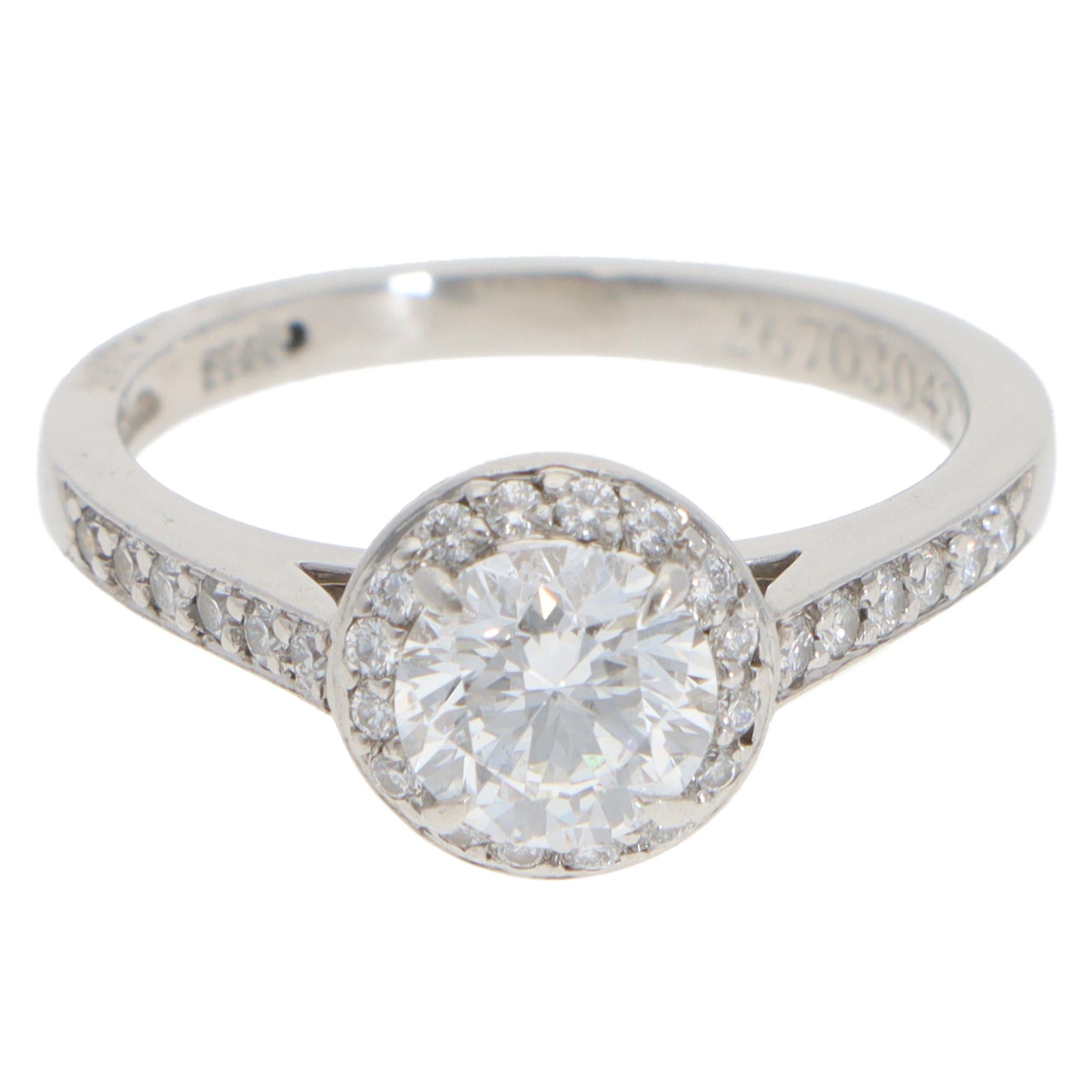 A beautiful vintage Tiffany & Co. Soleste round brilliant cut diamond halo ring set in platinum.

The ring is centrally set with a certified sparkly 0.85 carat round brilliant cut diamond which is four-claw set securely. The diamond is graded as a D