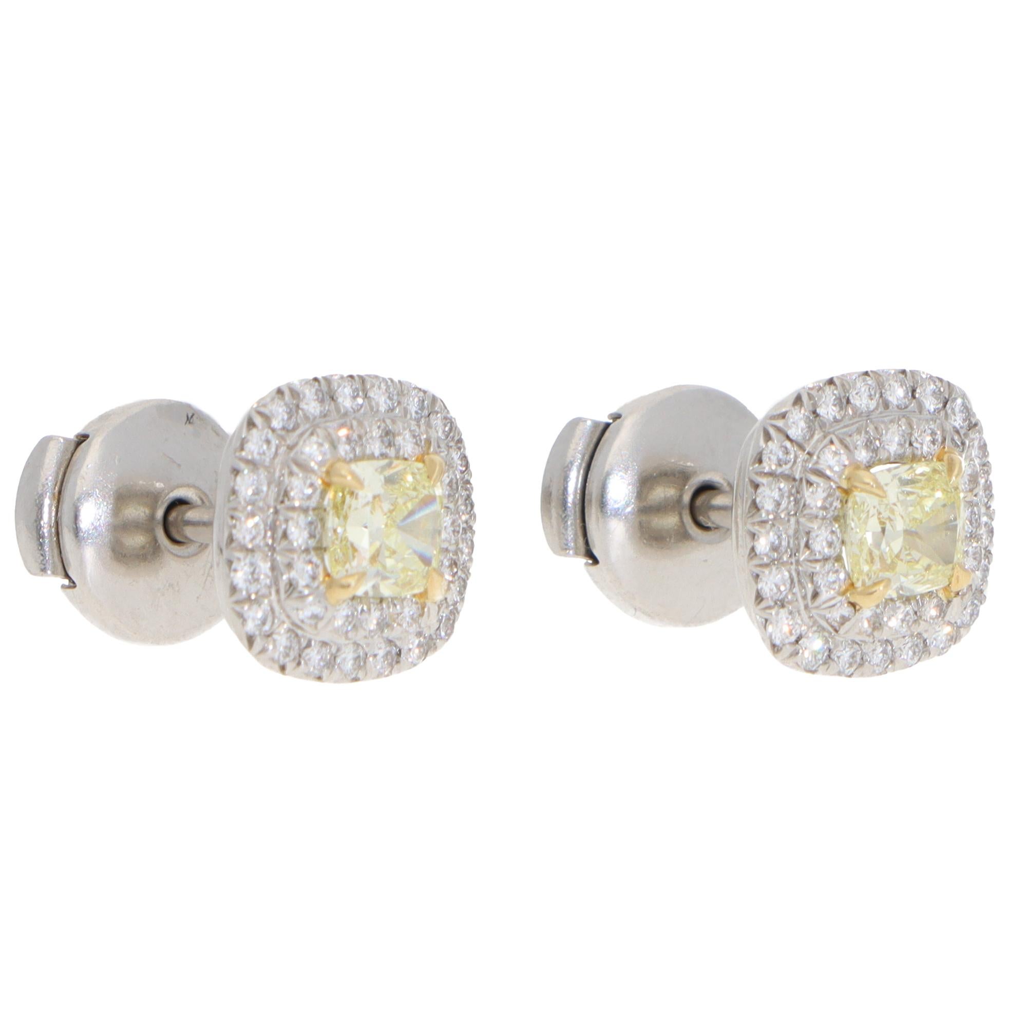 A beautiful pair of vintage Tiffany & Co. Soleste yellow diamond cluster stud earrings set in platinum and 18k yellow gold.

From Tiffany's current Soleste collection, each earring is centrally set with a cushion-cut yellow diamond and surrounded by