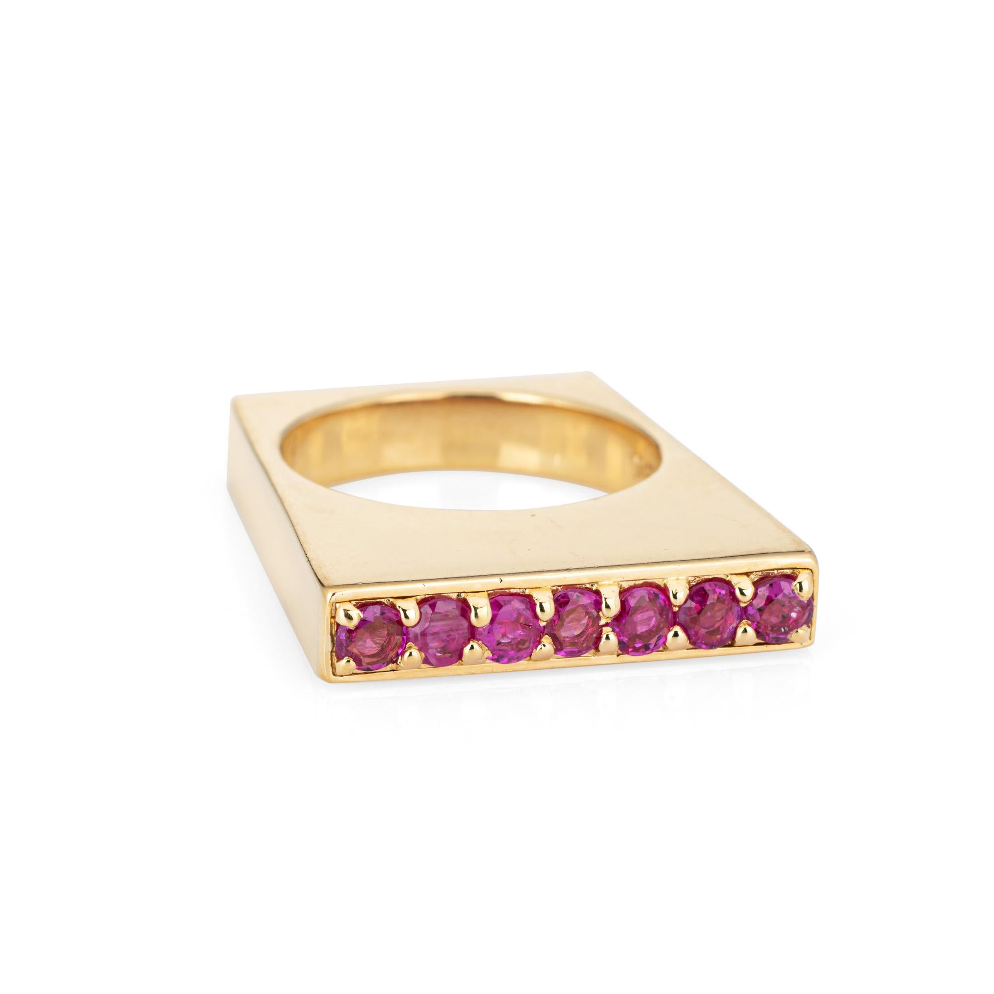 Vintage Tiffany & Co square ruby ring, crafted in 18k yellow gold (circa 1970s).  

7 rubies are estimated at 0.05 carats each and total an estimated 0.35 carats. The rubies are in good condition with a few minor chips visible under a 10x loupe.