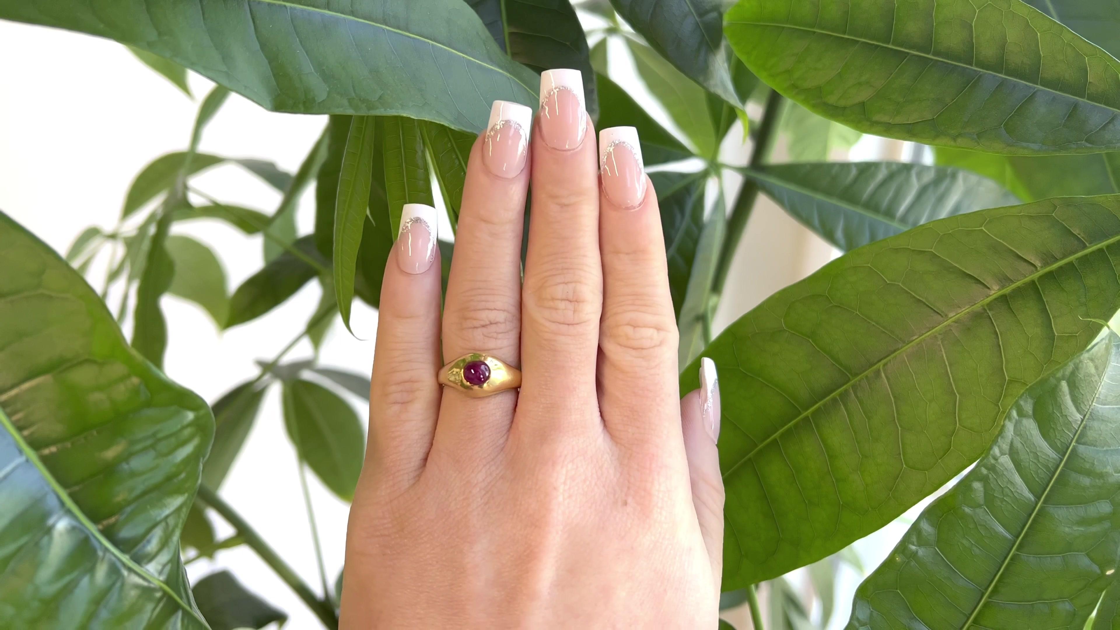 One Vintage Tiffany & Co. Star Ruby Solitaire 18 Karat Gold Bezel Set Ring. Featuring one cabochon cut star ruby of approximately 2.20 carats. Crafted in 18 karat yellow gold, signed Tiffany & Co. Circa 1970s. The ring is a size 6 1/4 and may be