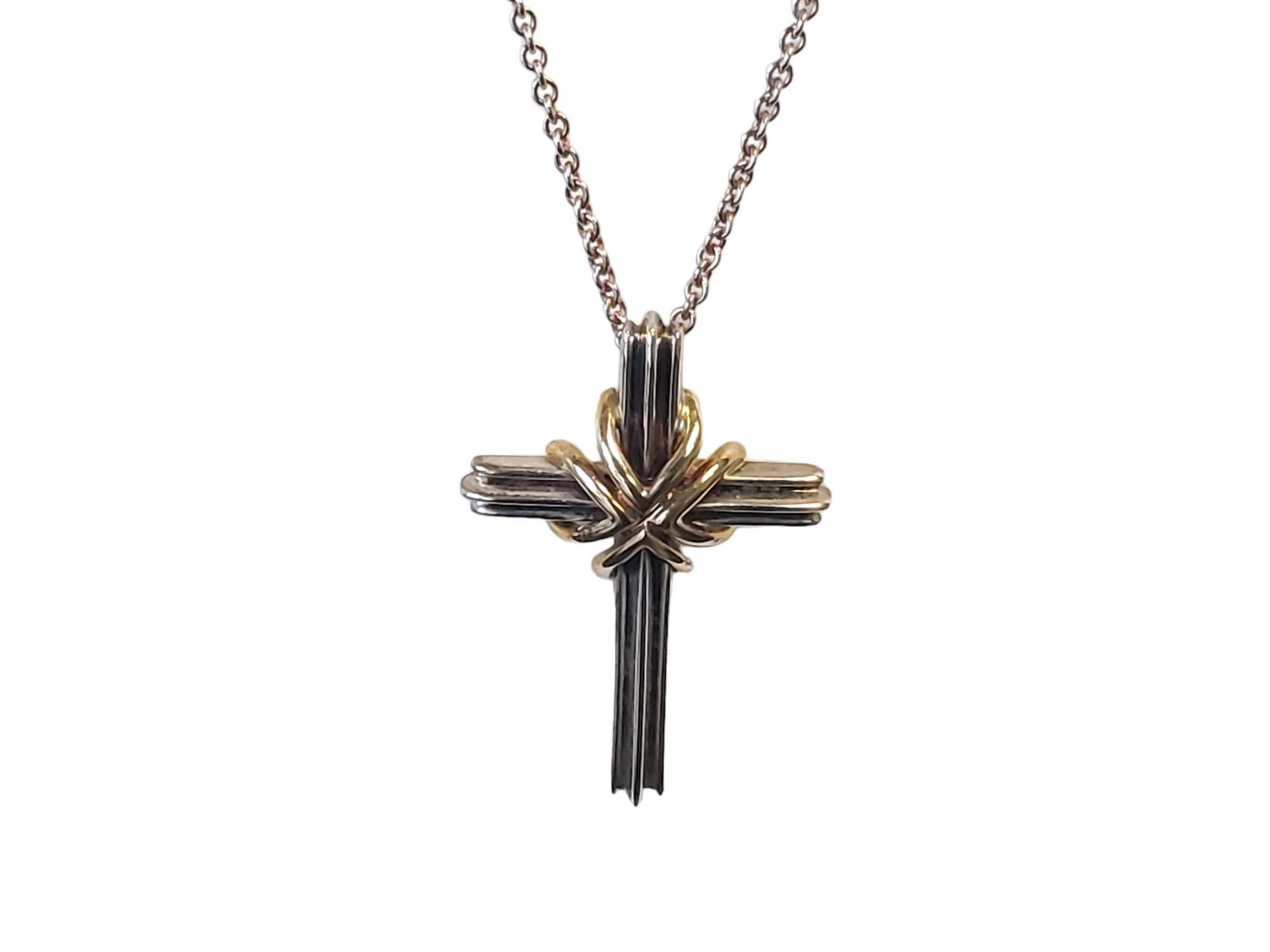 Vintage Tiffany Sterling 18k Croix et Collier

Listed is a vintage Tiffany & Co. sterling and 18k yellow gold cross with 24
