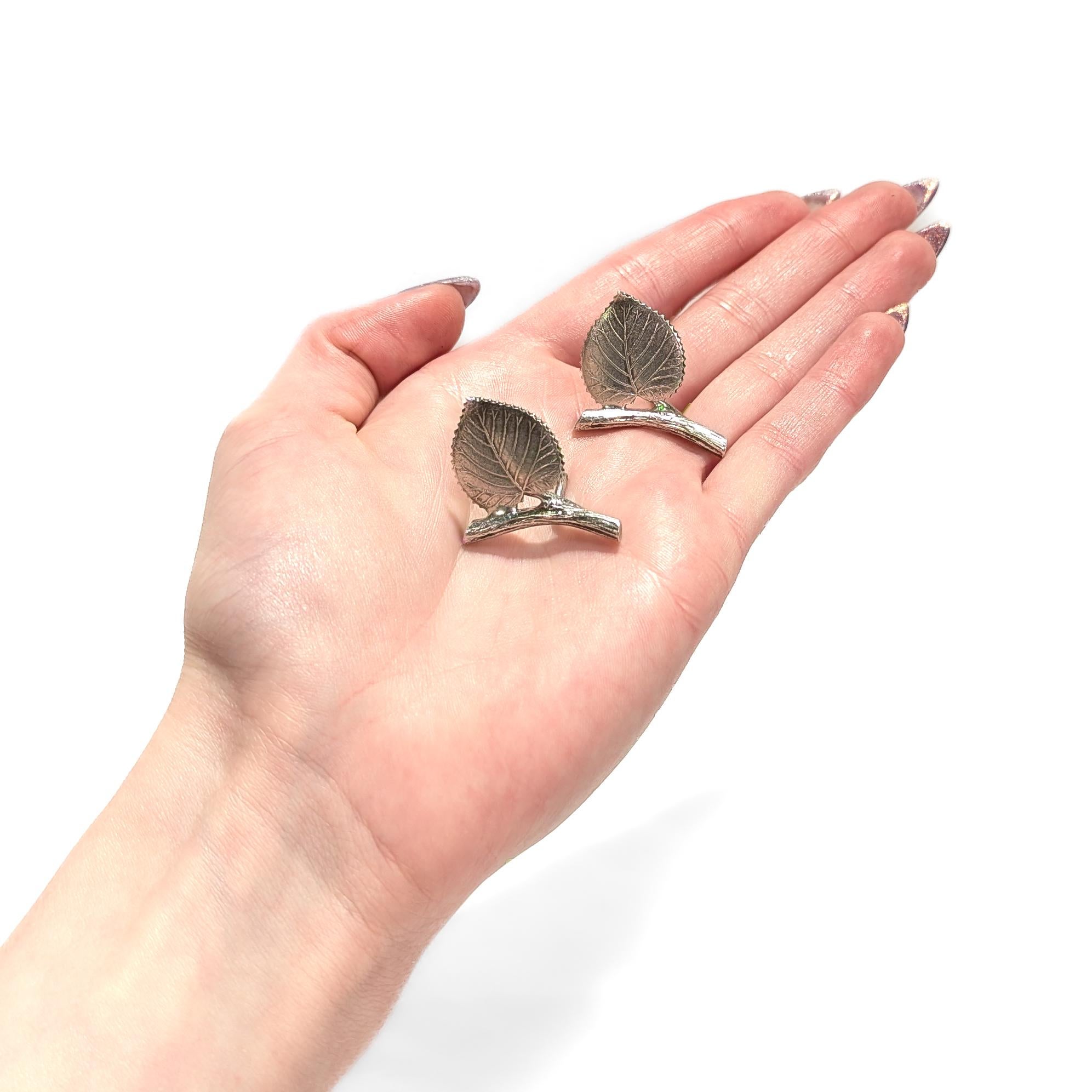 A fine pair of silver place card holders.

By Tiffany & Co.

In sterling silver.

Each in the form of a branch with a birch leaf.

Fully marked to the reverse.

Simply a wonderful placecard holders from Tiffany!

Date:
20th Century

Overall