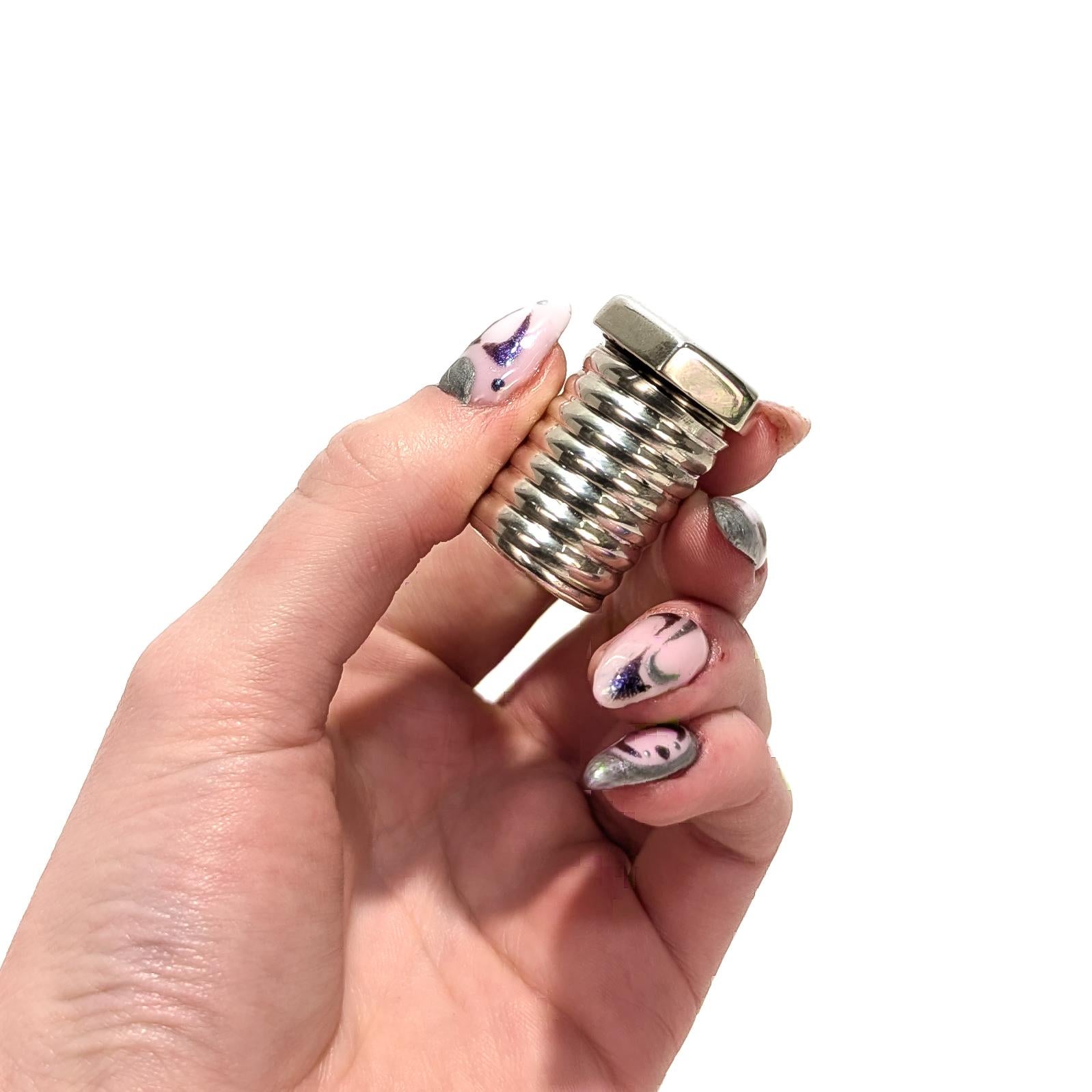 A fine, older vintage signed miniature box.

By Tiffany & Co.

In sterling silver.

In the form of a hex head bolt.

Marked Tiffany & Co. / Sterling to the bottom of the lid

Together with its original but (quite soiled) Tiffany felt pouch.