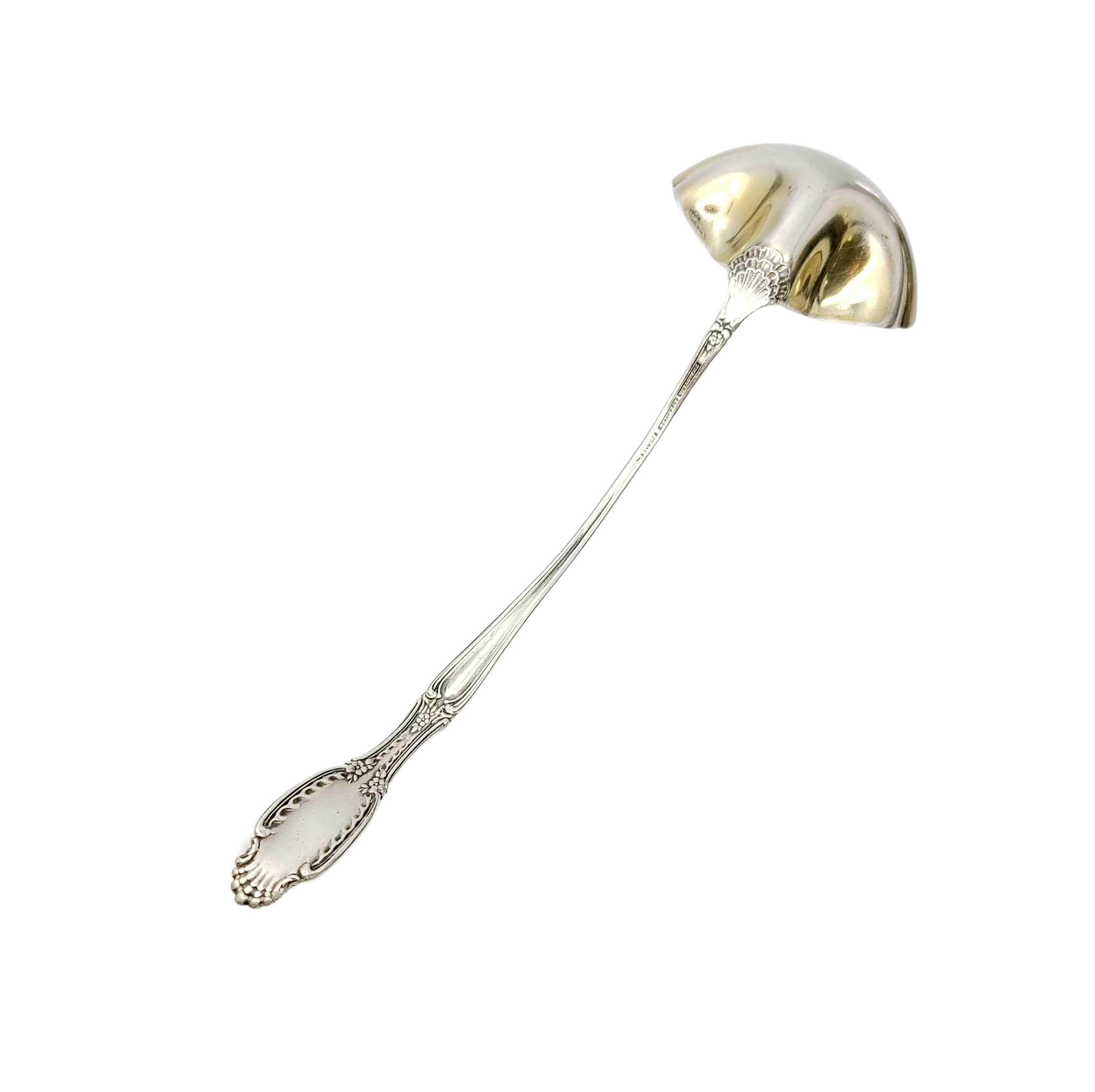 Antique Tiffany & Co. sterling silver cream ladle in the Richelieu pattern.

The Richelieu pattern was designed in 1892 by Paulding Farnham, Tiffany's chief designer of the time. This piece features a fluted, gold washed bowl. The T mark dates