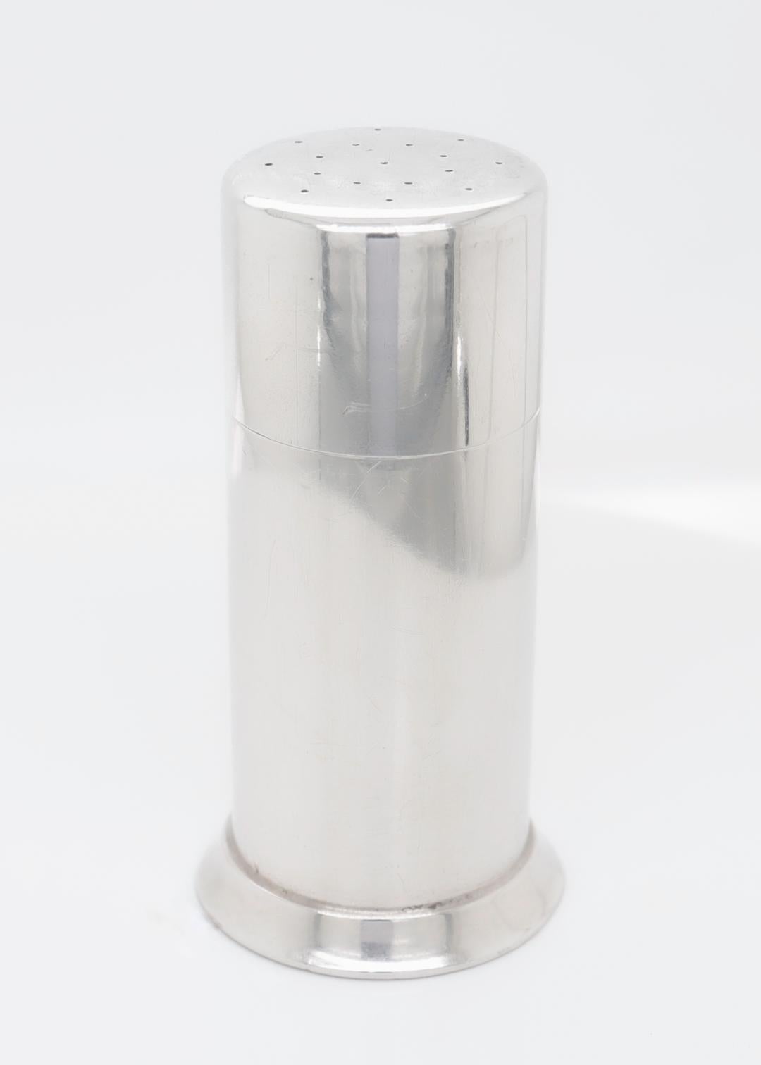 A fine Mid-Century envelope (or stamp) moistener.

In sterling silver.

By Tiffany & Co. 

Model no. 23670.

In bullet or shaker form, the lid with tiny perforations that finely limits water for moistening the envelope.

Produced between 1956 - 1965
