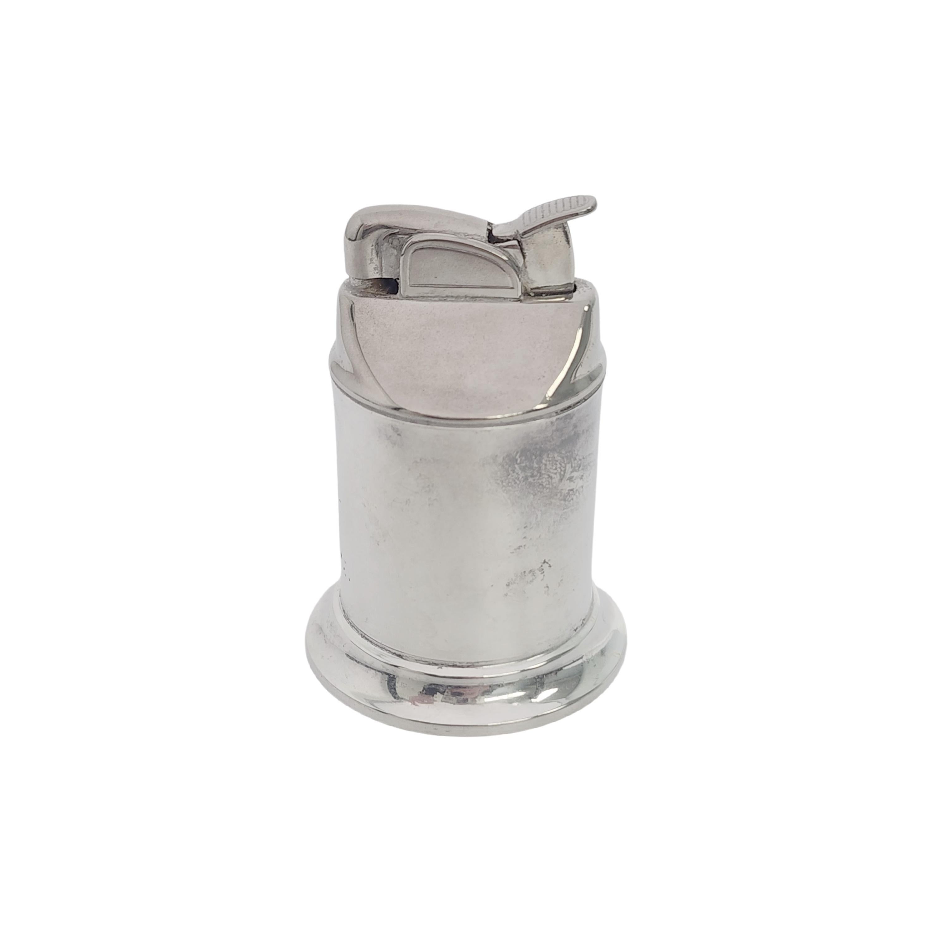 Sterling silver table lighter by Tiffany & Co, circa 1956.

No monogram

Simple and classic smooth polished finish on a cylindrical Art Deco design. Inner petrol wick lighter by Evans. Tiffany box and pouch are not included.

Measures approx 3 1/4
