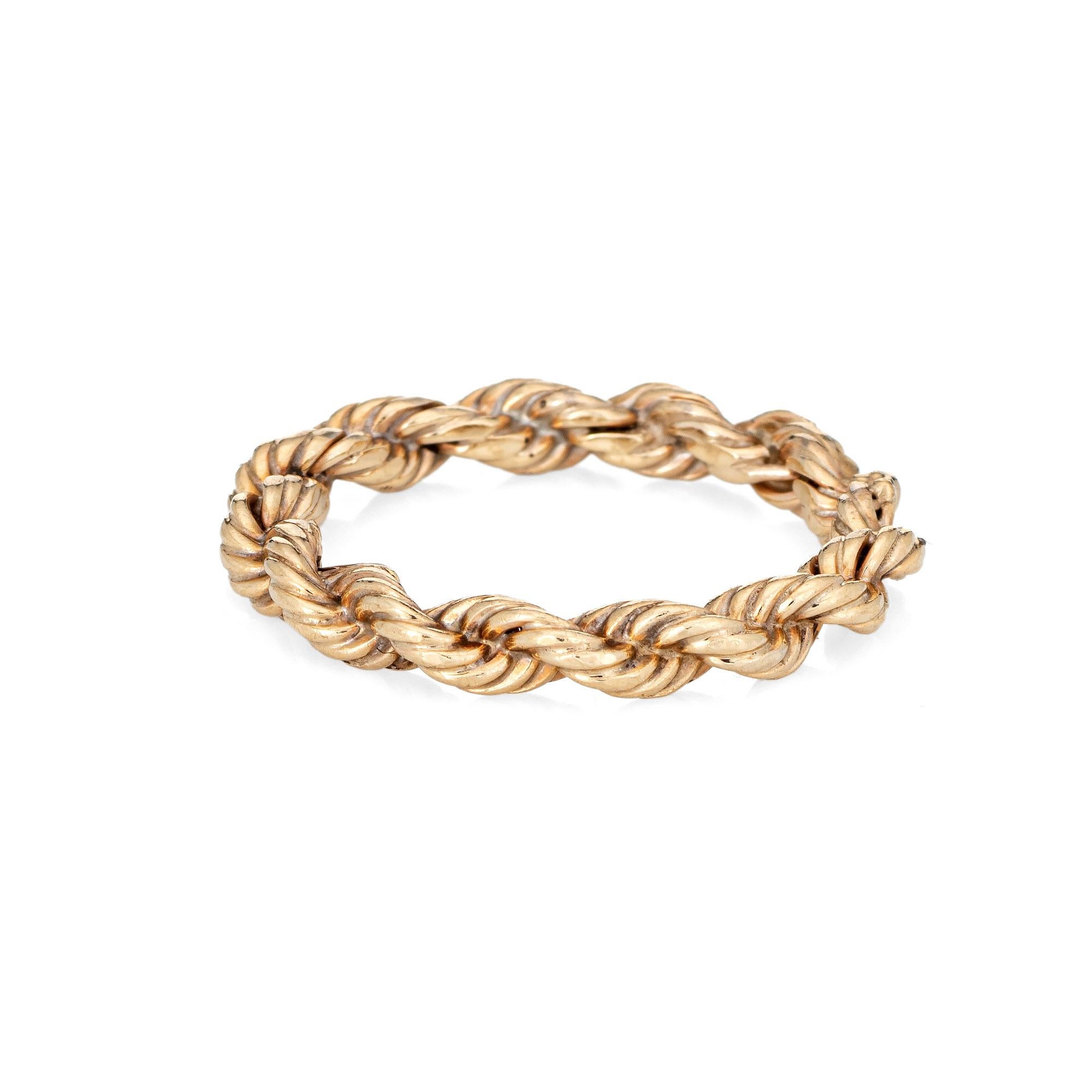 Vintage Tiffany & Co Succo rope twist band crafted in 14k yellow gold (circa 1960s to 1970s).  

The out of production vintage Tiffany ring features a rope twist design. The ring is great worn alone or stacked with your fine jewelry from any
