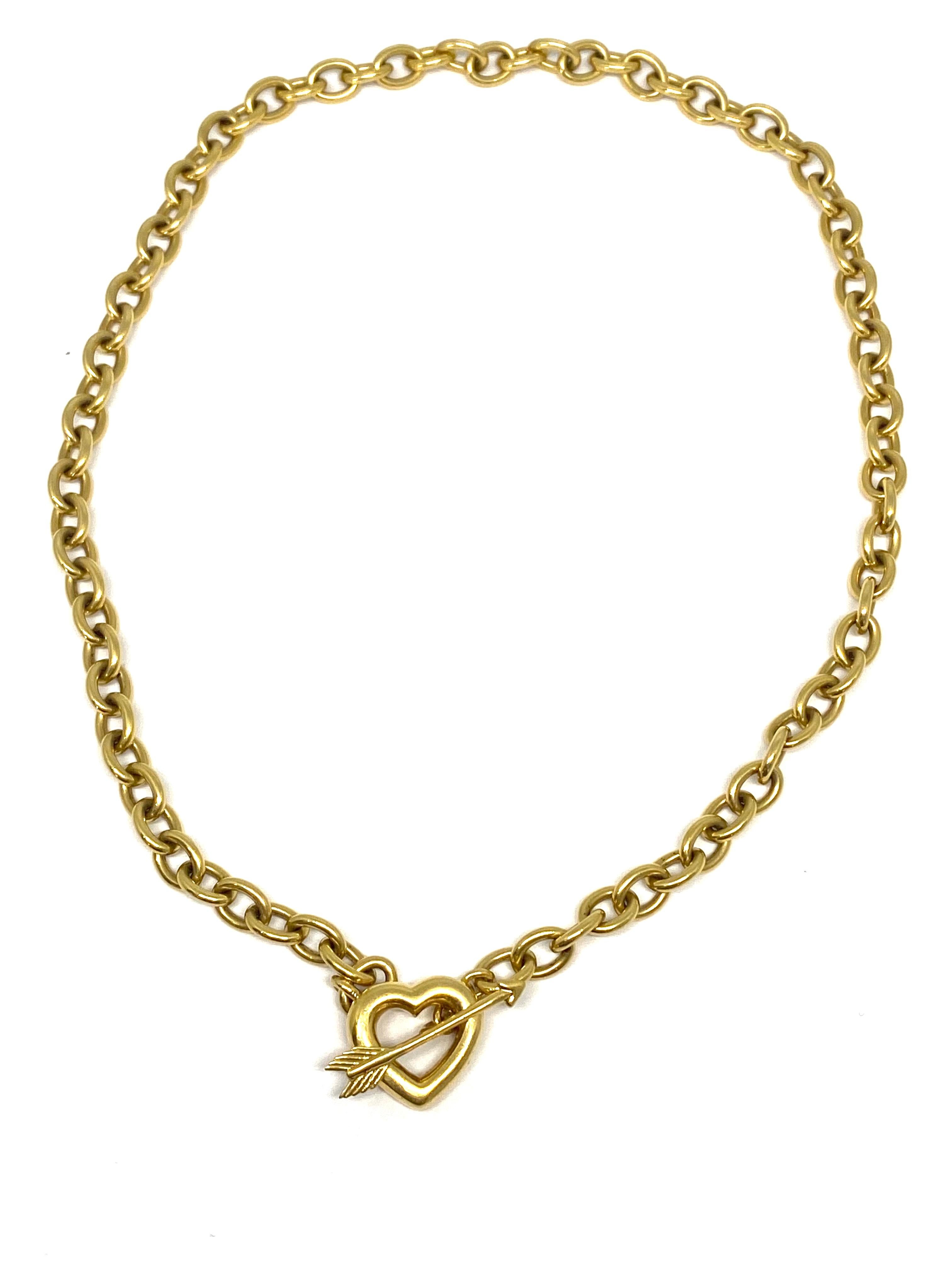 Product details:
Circa 1994.
Featuring oval shaped cable link chain necklace with heart and error toggle clasp in 18K yellow gold finish.
Signed Tiffany & Co., stamped 750 and 1994.
The heart measures 5/8