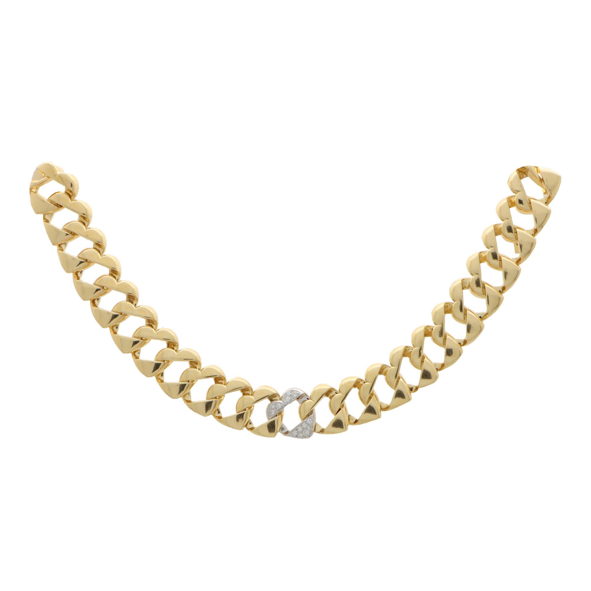 A beautiful vintage Tiffany & Co. twisted heart flat curb link necklace set in 18k yellow and white gold.

The necklace is composed of 49 individual heart styled flat curb links and sits beautifully once on the neck. The necklace feels fabulous to