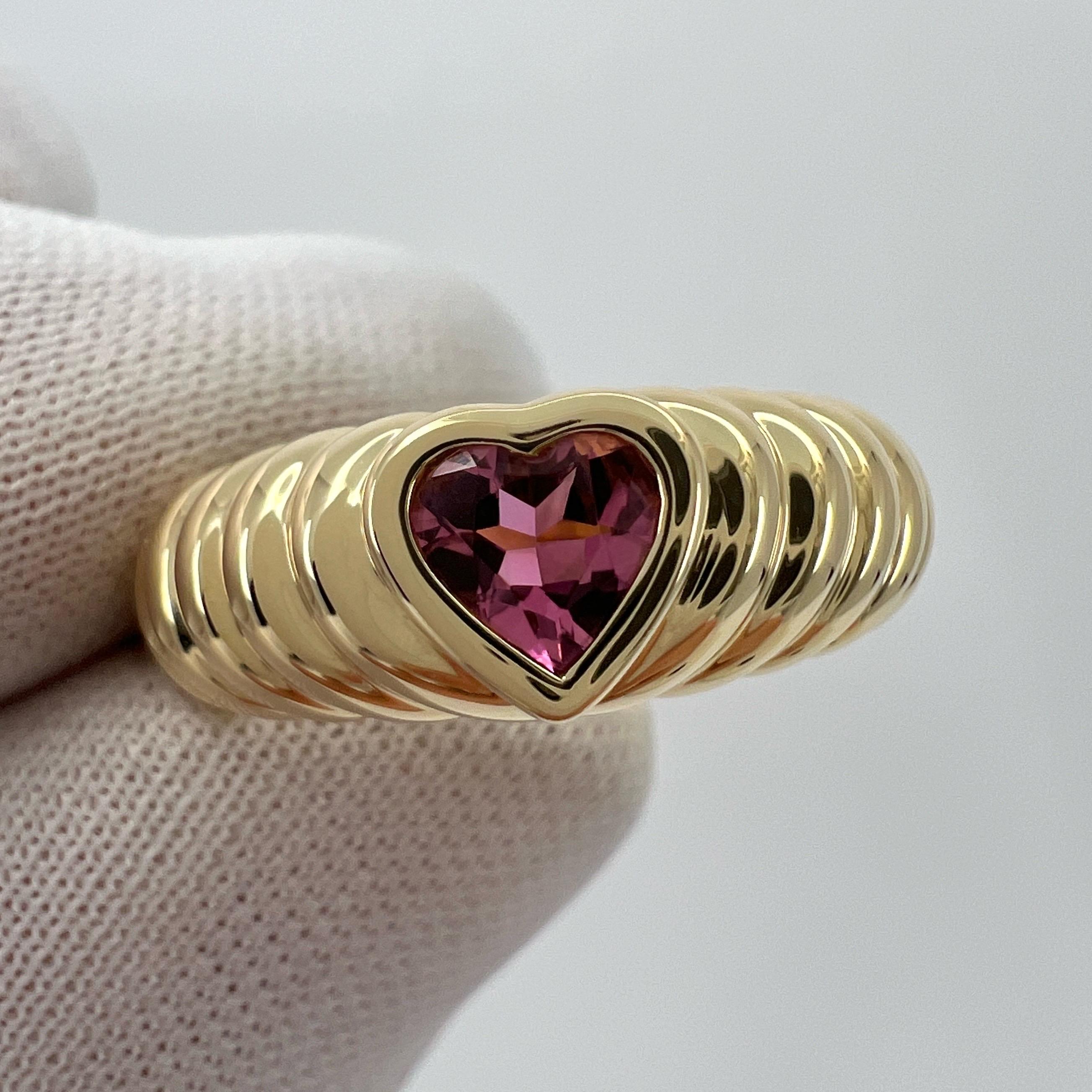 Rare Tiffany & Co. Vivid Pink Tourmaline Heart Cut 18k Yellow Gold Band Ring.

A beautifully made yellow gold ring set with a stunning vivid pink heart cut natural tourmaline. Superb colour, clarity and cut. Fine jewellery houses like Tiffany only