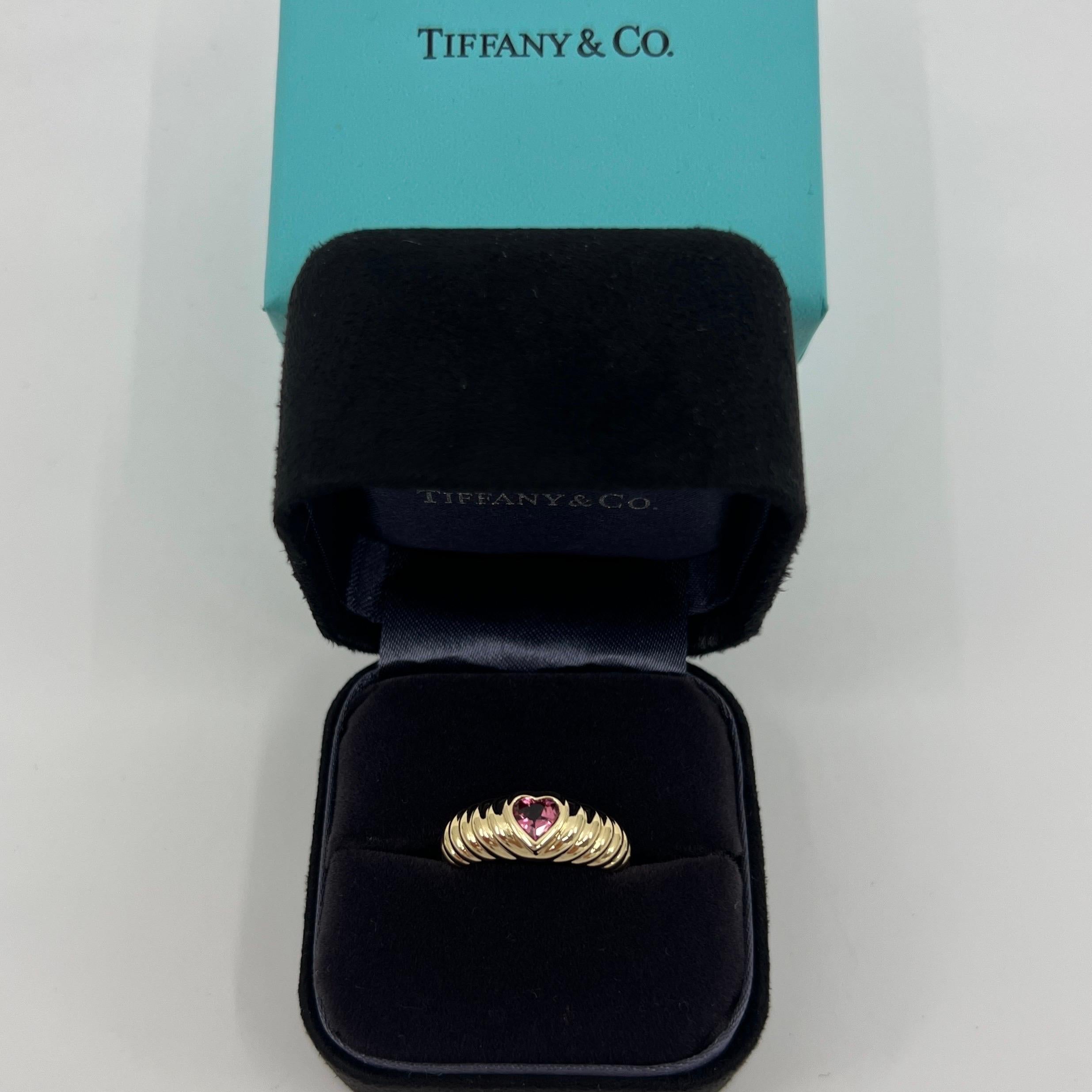 Rare Tiffany & Co. Vivid Pink Tourmaline Heart Cut 18k Yellow Gold Band Ring.

A beautifully made yellow gold ring set with a stunning vivid pink heart cut natural tourmaline. Superb colour, clarity and cut. Fine jewellery houses like Tiffany only