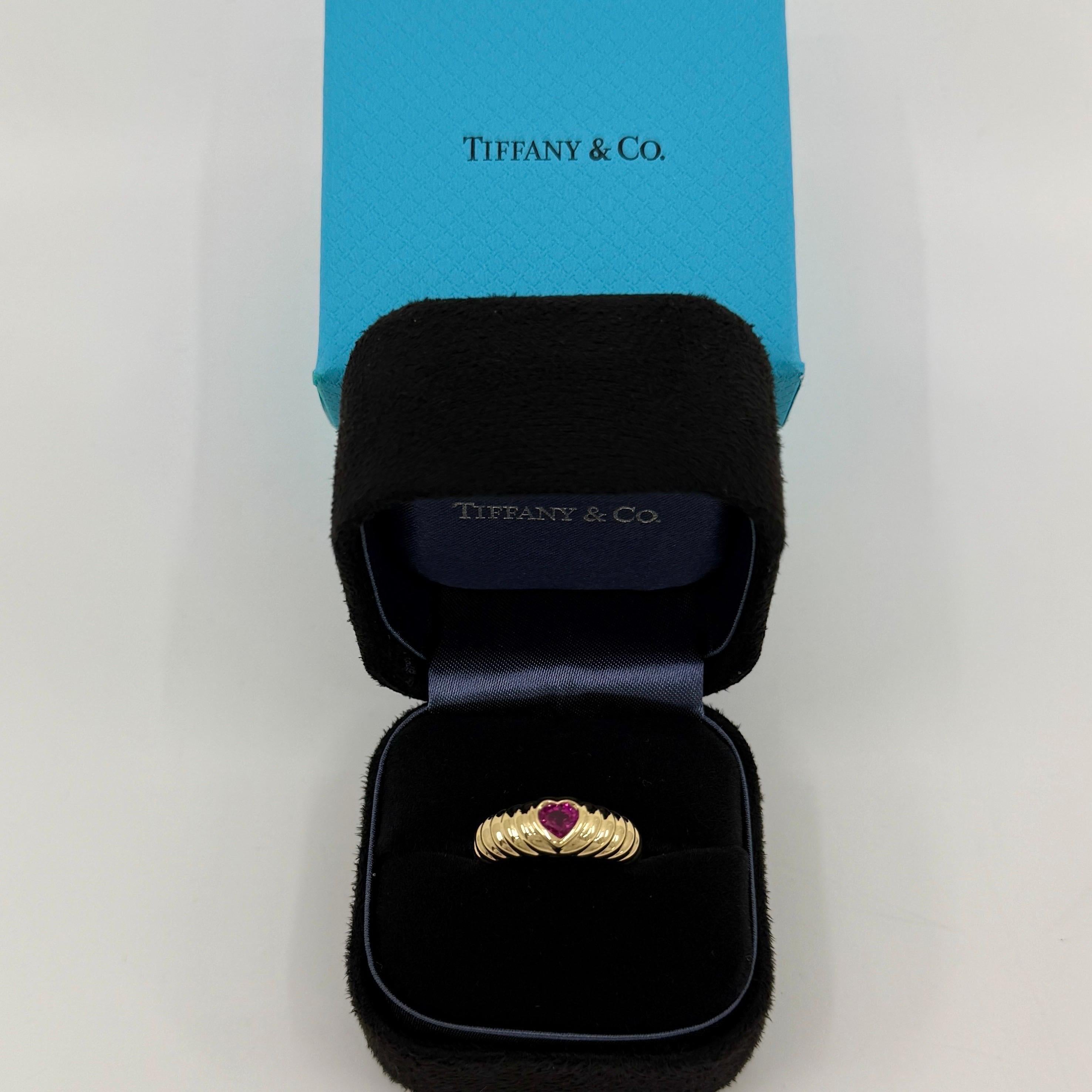 Rare Tiffany & Co. Vivid Vivid Pinkish Red Ruby Heart Cut 18k Yellow Gold Band Ring.

A beautifully made yellow gold ring set with a stunning vivid pinkish red heart cut ruby. Superb colour, clarity and cut. Fine jewellery houses like Tiffany only