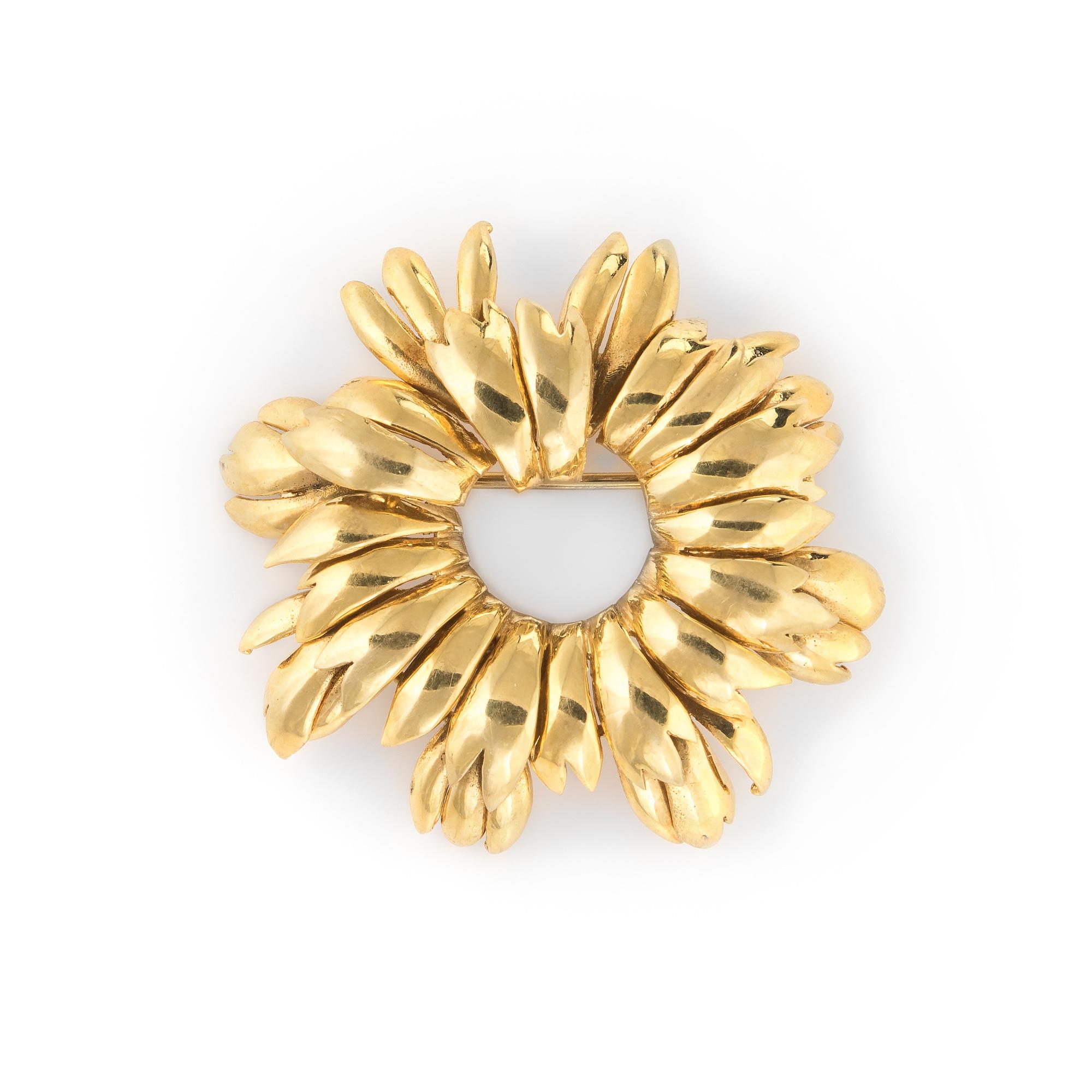 round gold brooch