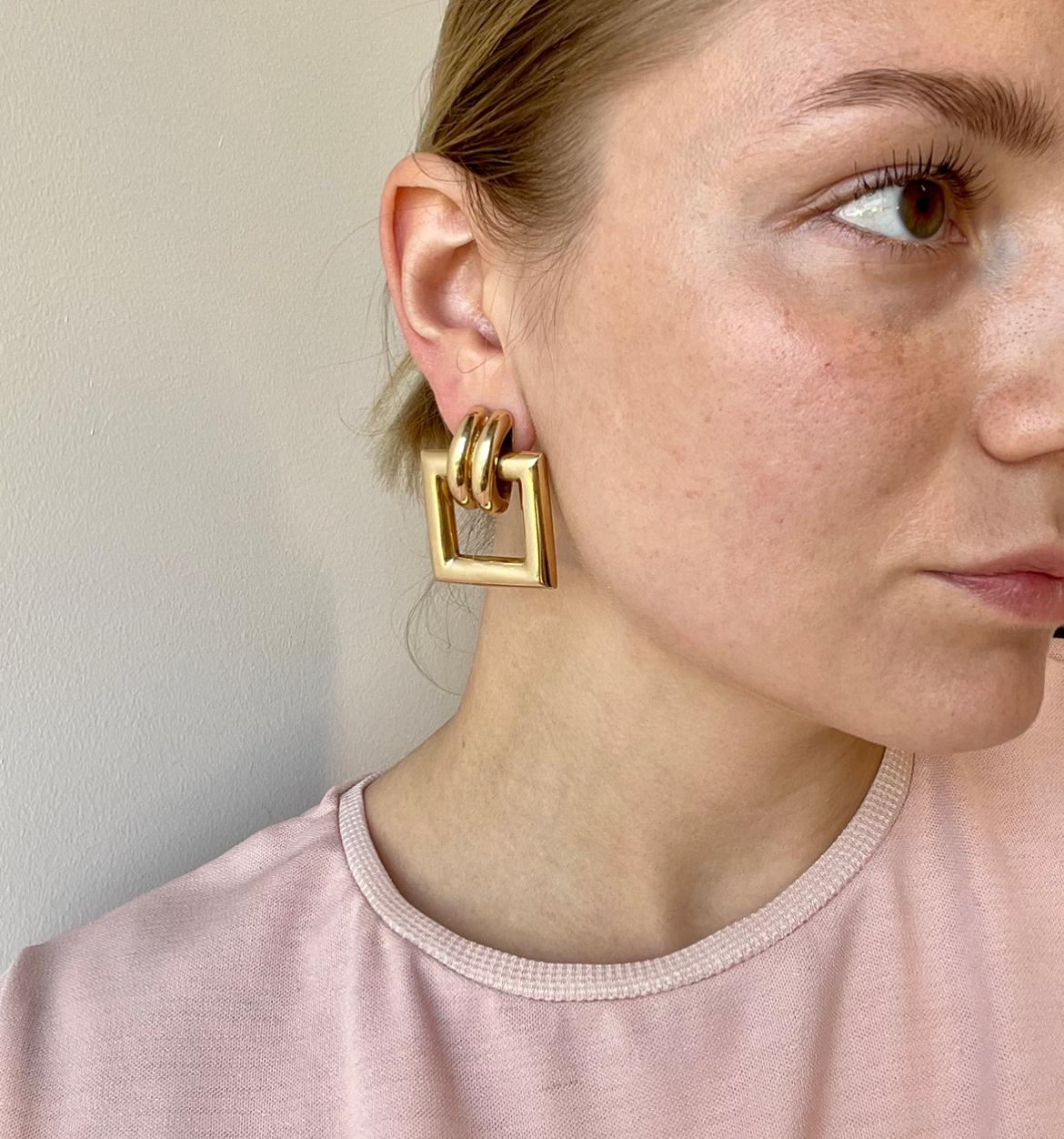 Vintage Tiffany & Co. Yellow Gold Door Knocker Earrings. Signed Tiffany, with purity marks. Circa 1990’s. The length is 1 1/2 inches. 

About The Piece: Solid, yellow gold jewelry has always been popular, but now it's trending even more. Own a pair