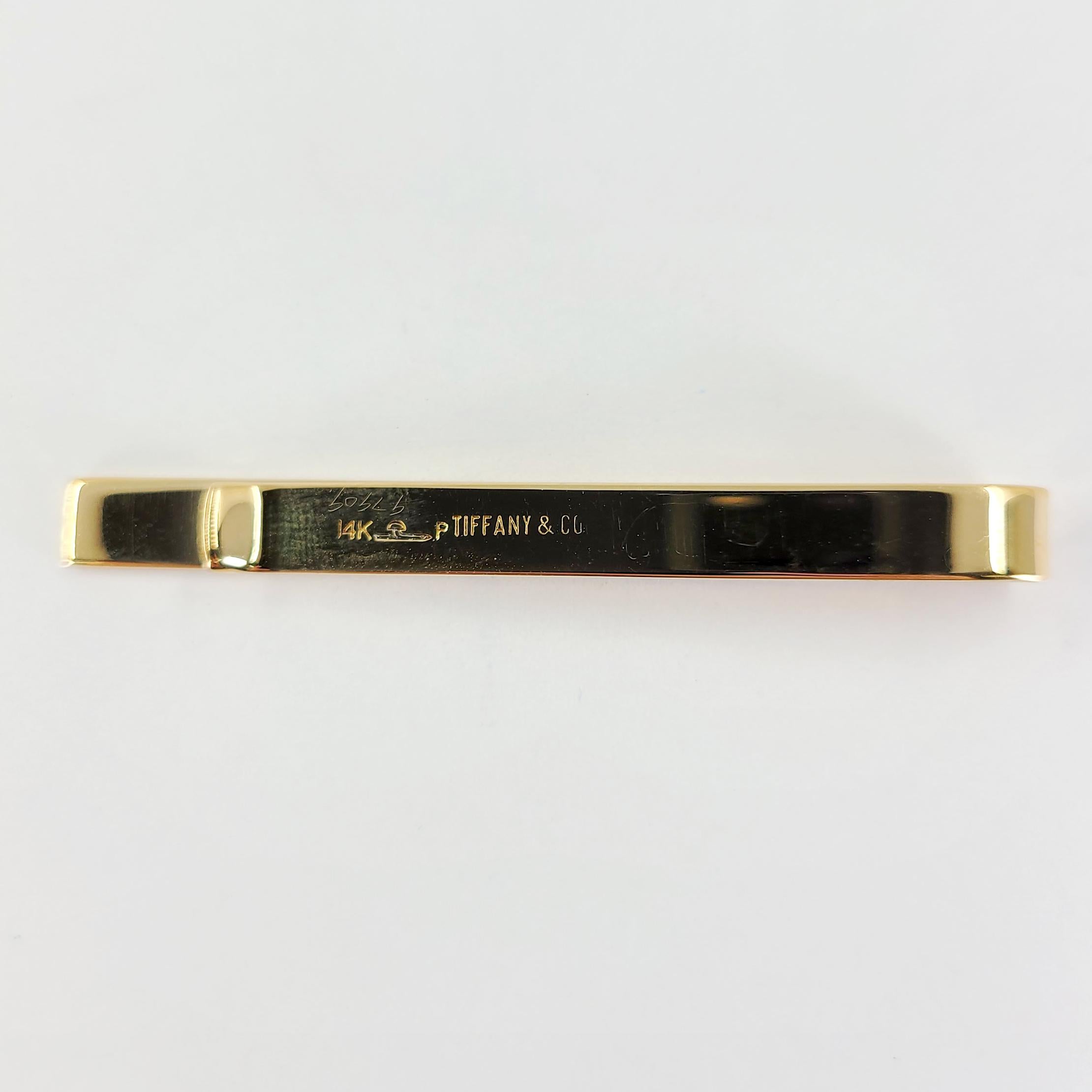 Tiffany & Co 14 Karat Yellow Gold Vintage Engravable Tie Bar. Finished Weight Is 7.4 Grams. 2 Inches Long.