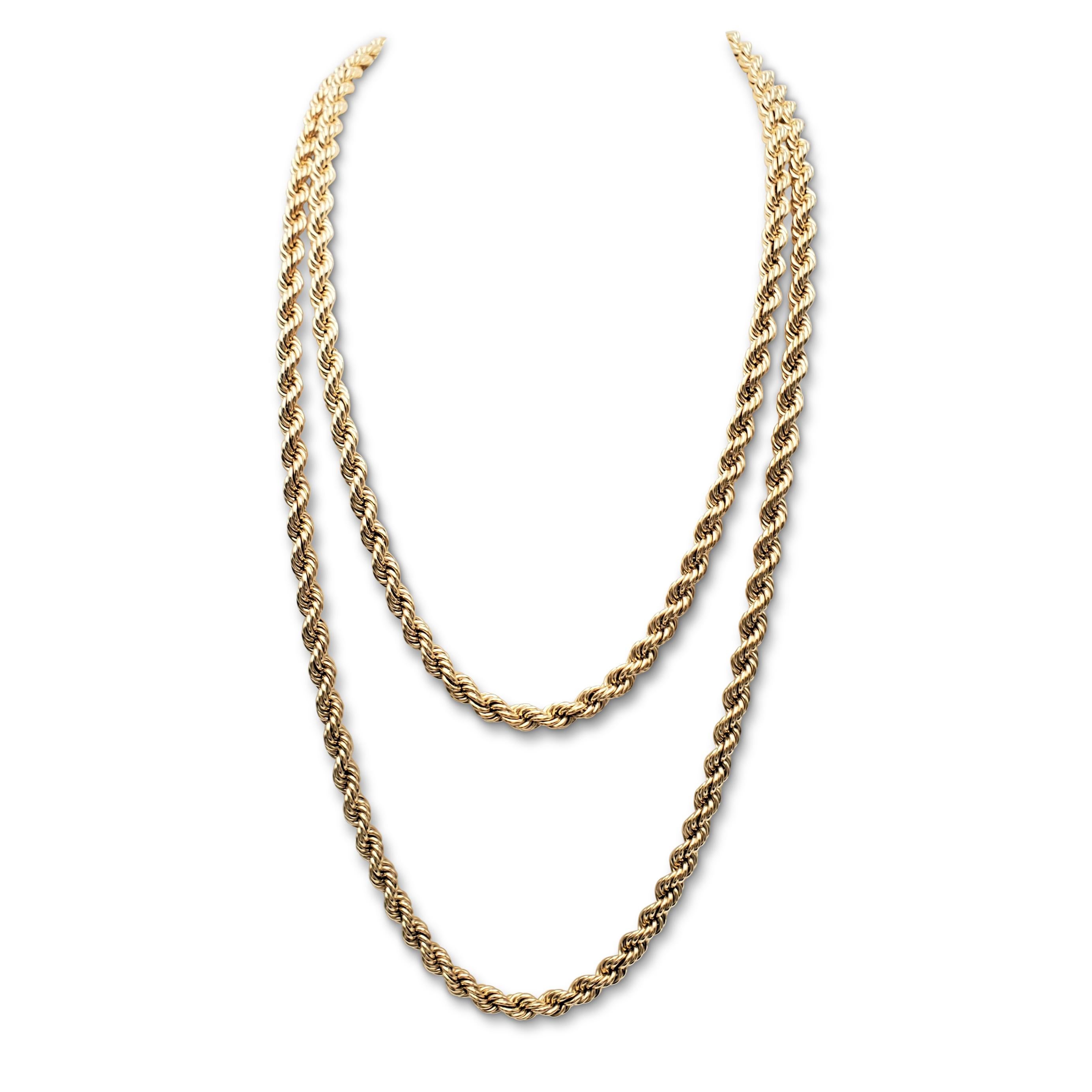 Authentic vintage Tiffany & Co. extra-long twisted rope chain necklace crafted in 14 karat yellow gold. Signed T&Co., 585. The necklace measures 60 inches in length. Not presented with the original box or papers. CIRCA 1980-1990s.

Necklace Length: