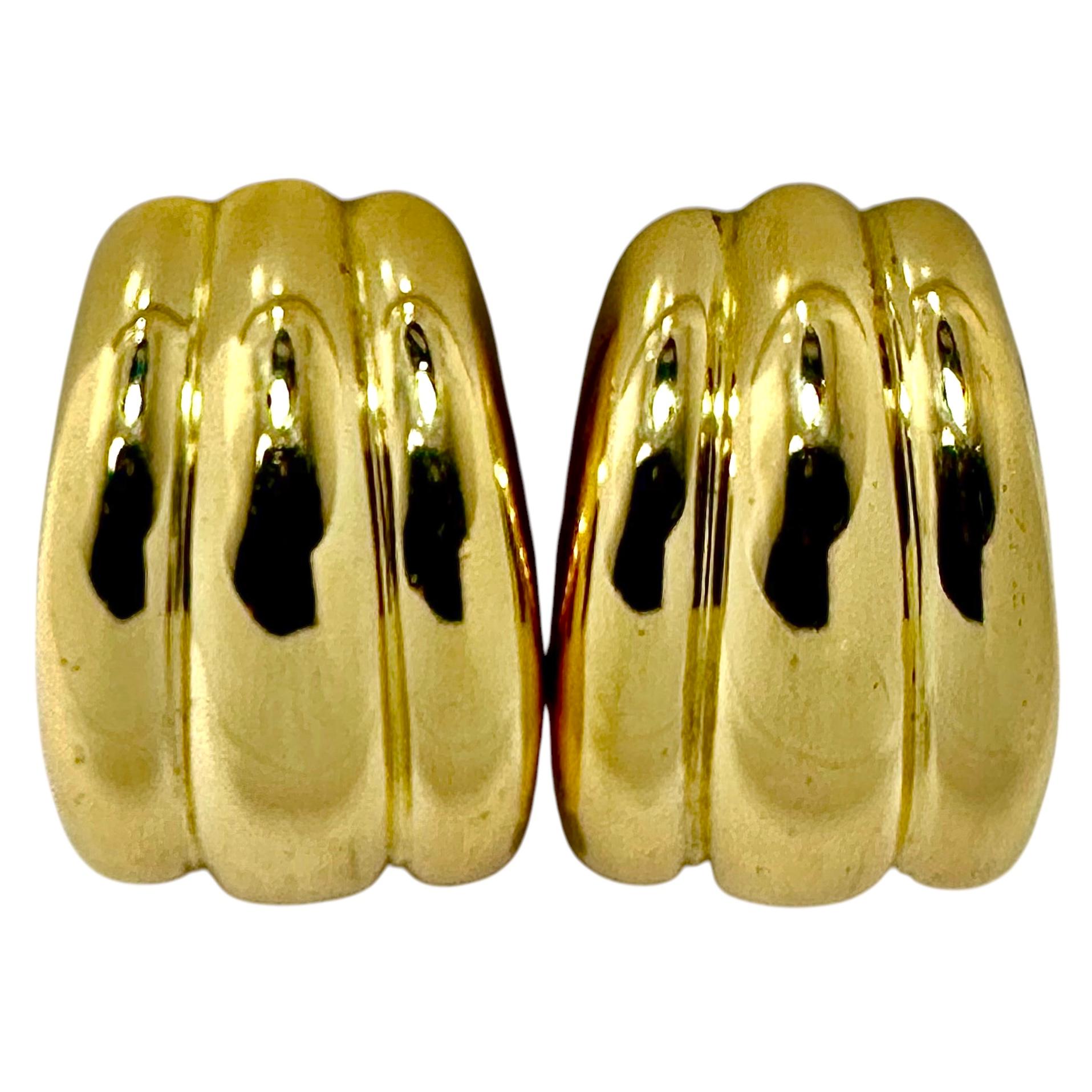 This wonderful pair of vintage Tiffany & Co. clip-on earrings is neither diminutive nor is it grandiose in scale. In fact, they are exactly the right size for wear to business or for daytime / night time casual use. Three deeply fluted bombe panels