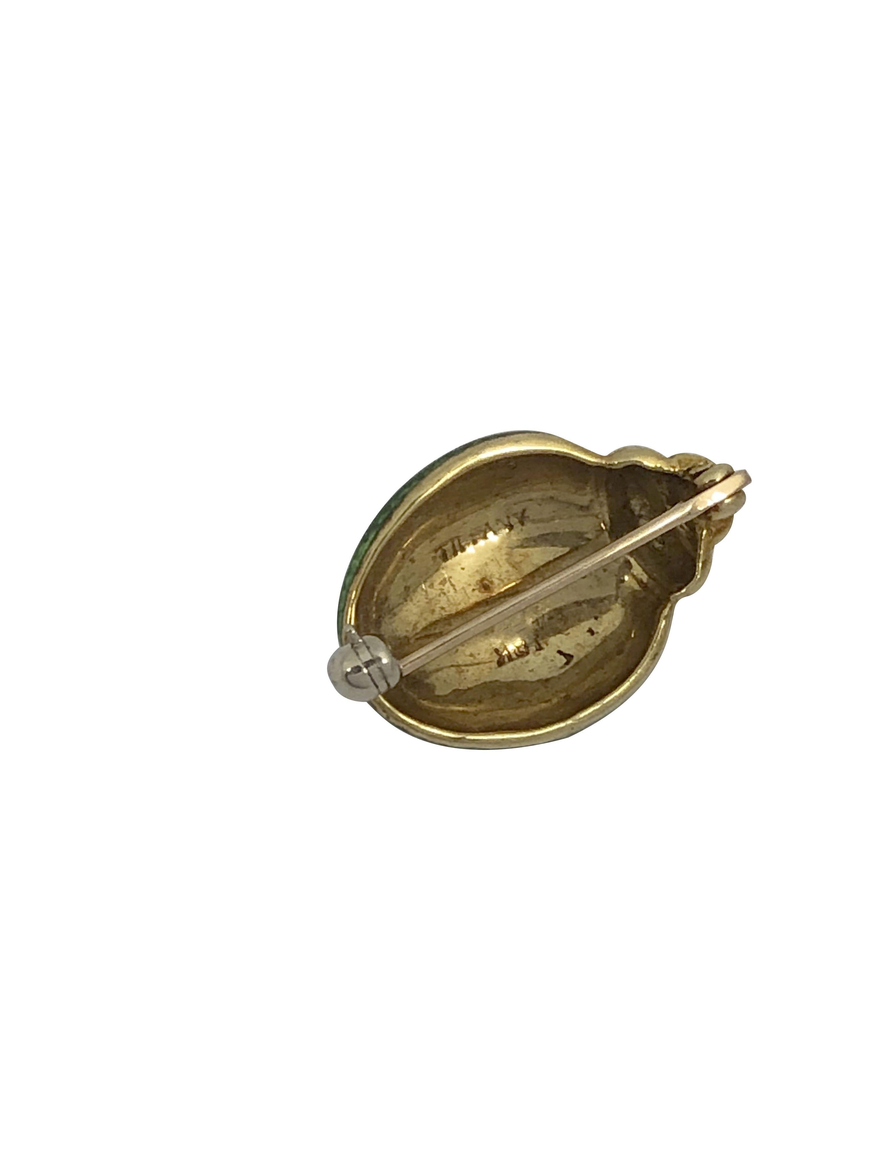 Circa 1970s Tiffany & Company 18k Yellow Gold Lady Bug Pin Brooch, measuring 3/4 inch in length, 1/2 inch wide and weighing 4.4 Grams. Finished in hard fired Guilloche Green Enamel with White Hearts. 