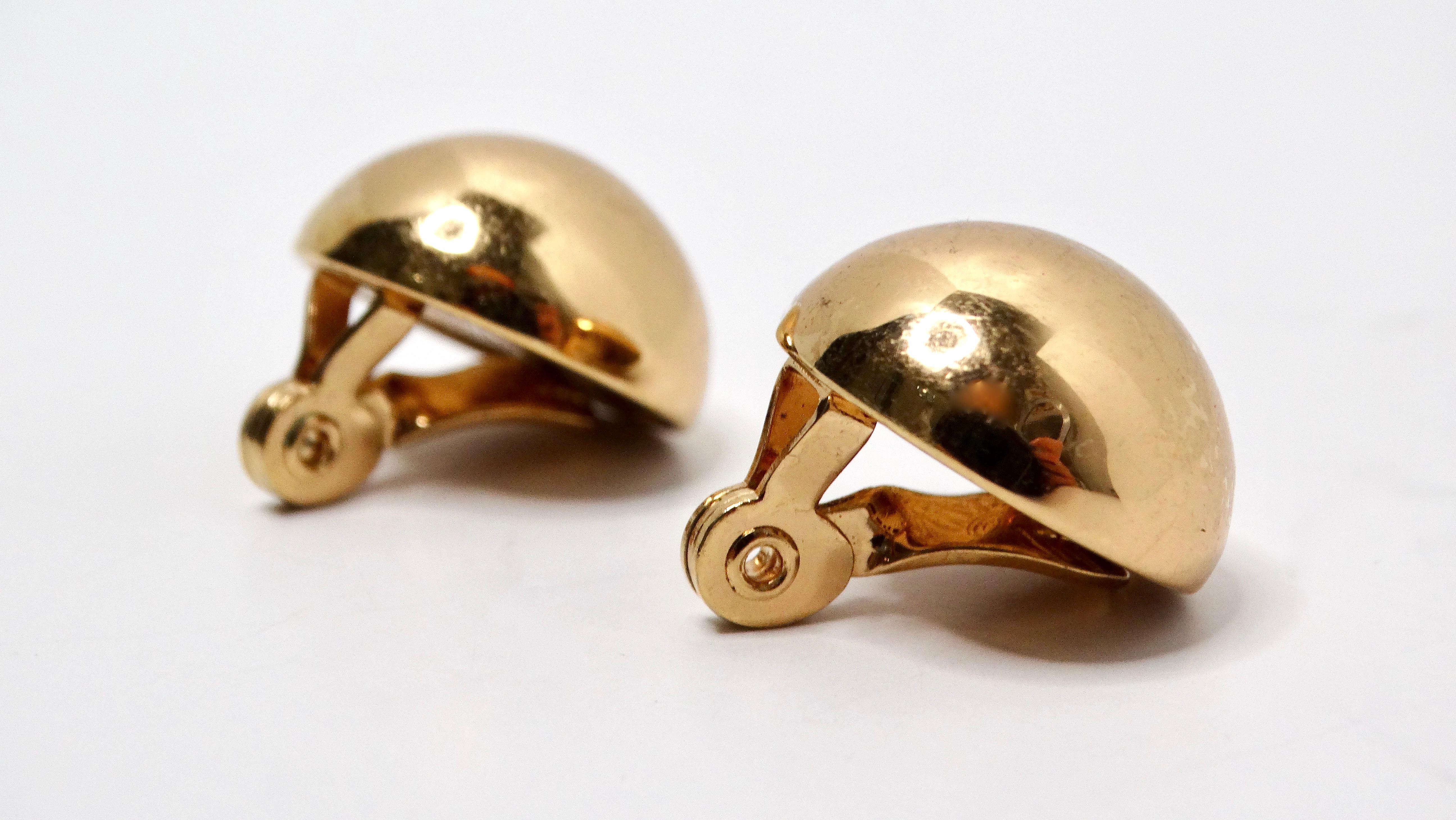 These Vintage Tiffany Inspired Monet 14k Gold Plated Round Dome Clip-On Earrings embody a timeless elegance that seamlessly complements any sophisticated wardrobe. Crafted with meticulous attention to detail, these earrings feature a striking dome