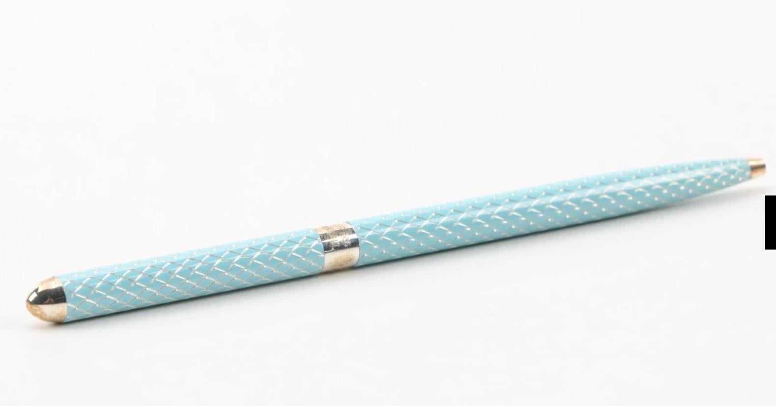 A vintage Tiffany & Co. sterling silver 925 enamel ballpoint pen.

A beautiful jewel-like Tiffany blue diamond pattern enamel pen,
with Tiffany & Co. sterling 925 mark in the center. 
Included is the original flannel Tiffany branded case 
in